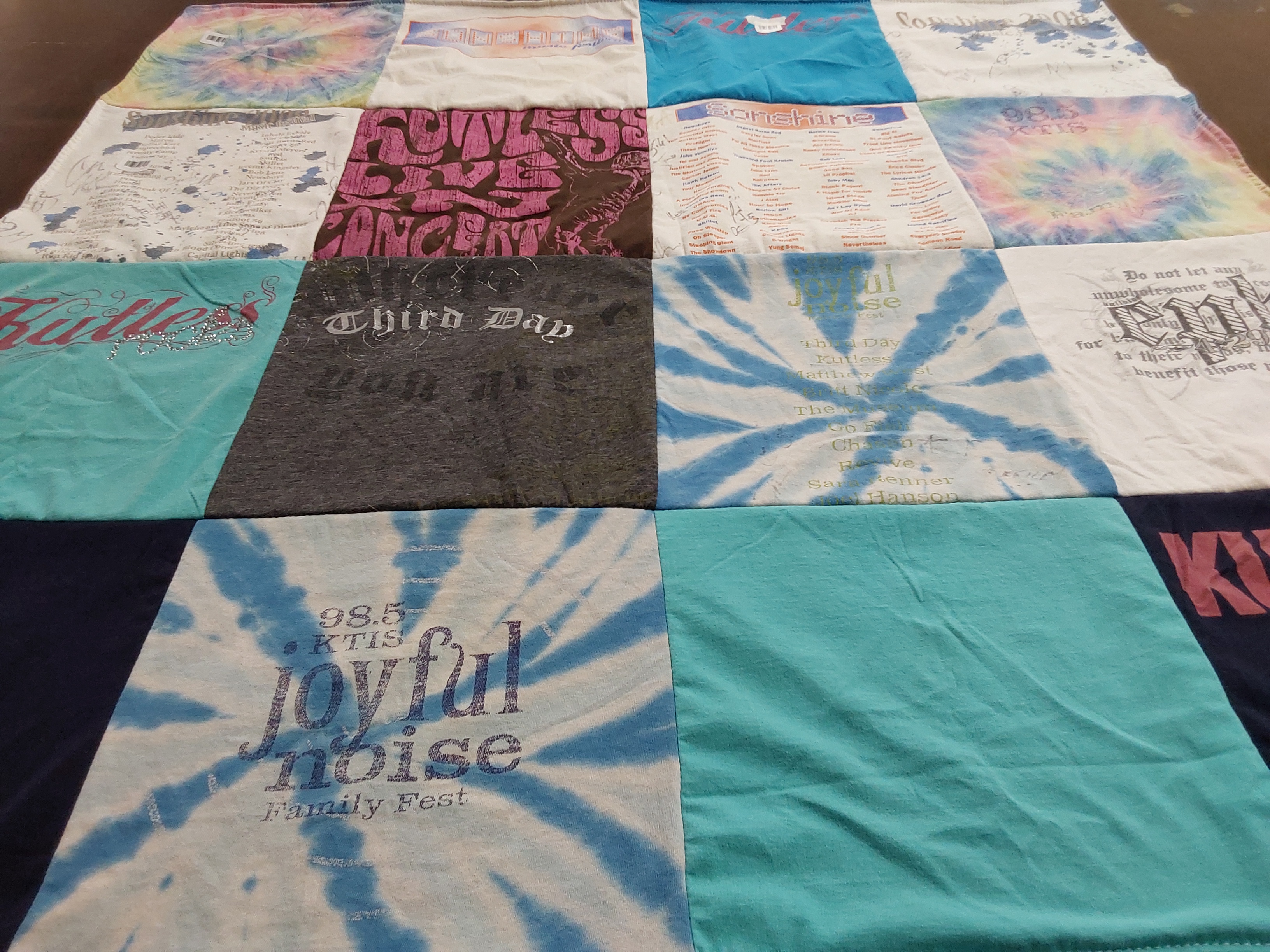 T-shirt quilt with music, family events themes by Gail from MN
