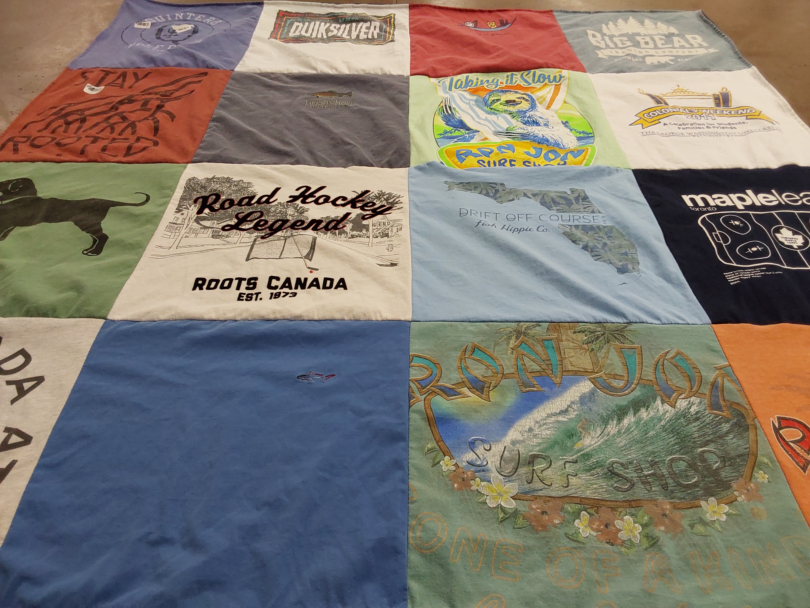 T-shirt quilt with hockey, surfing themes by Rhonda from DC