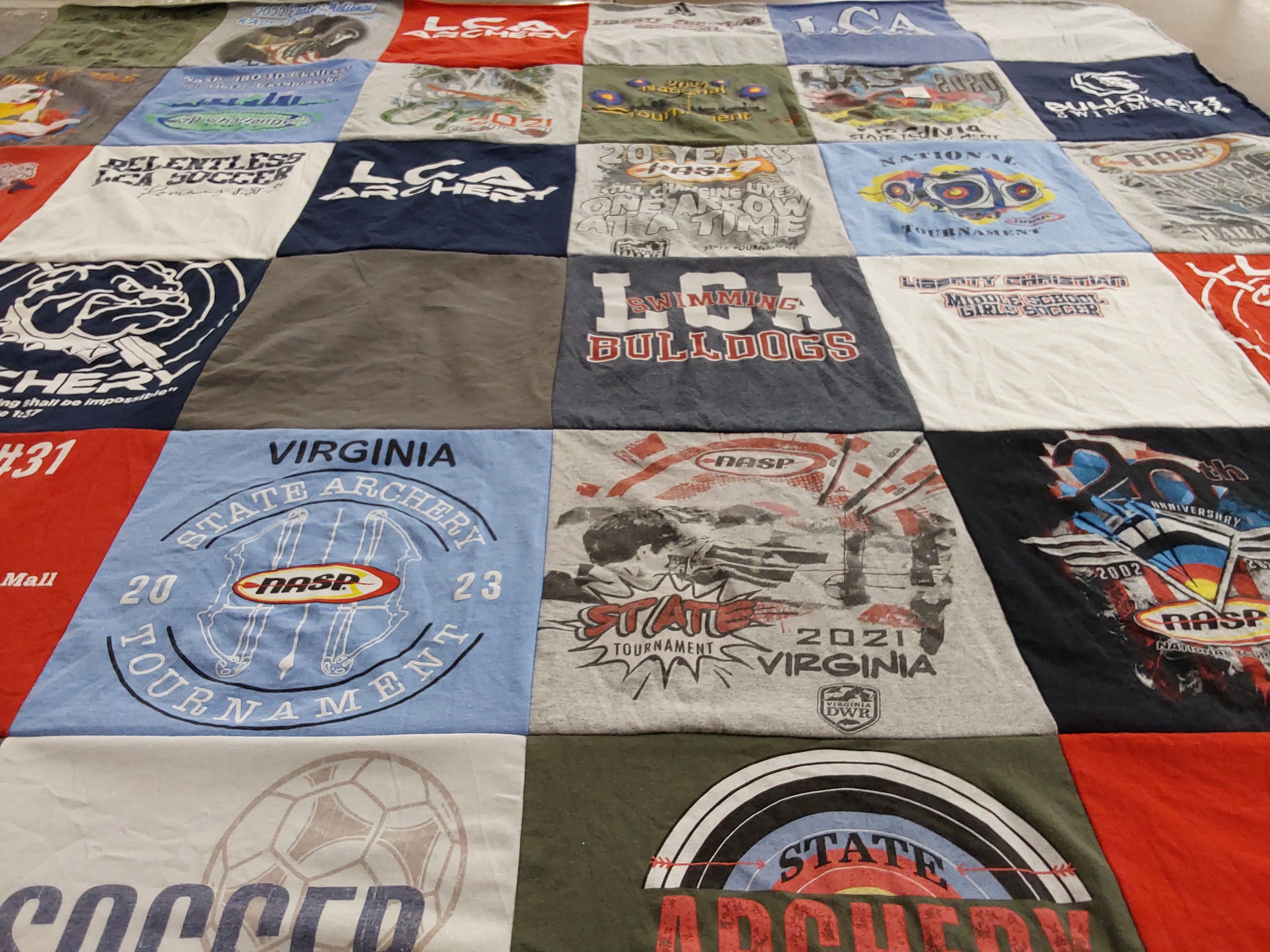 T-shirt quilt featuring liberty christian academy bulldogs, lca archery by KATHLEEN from VA