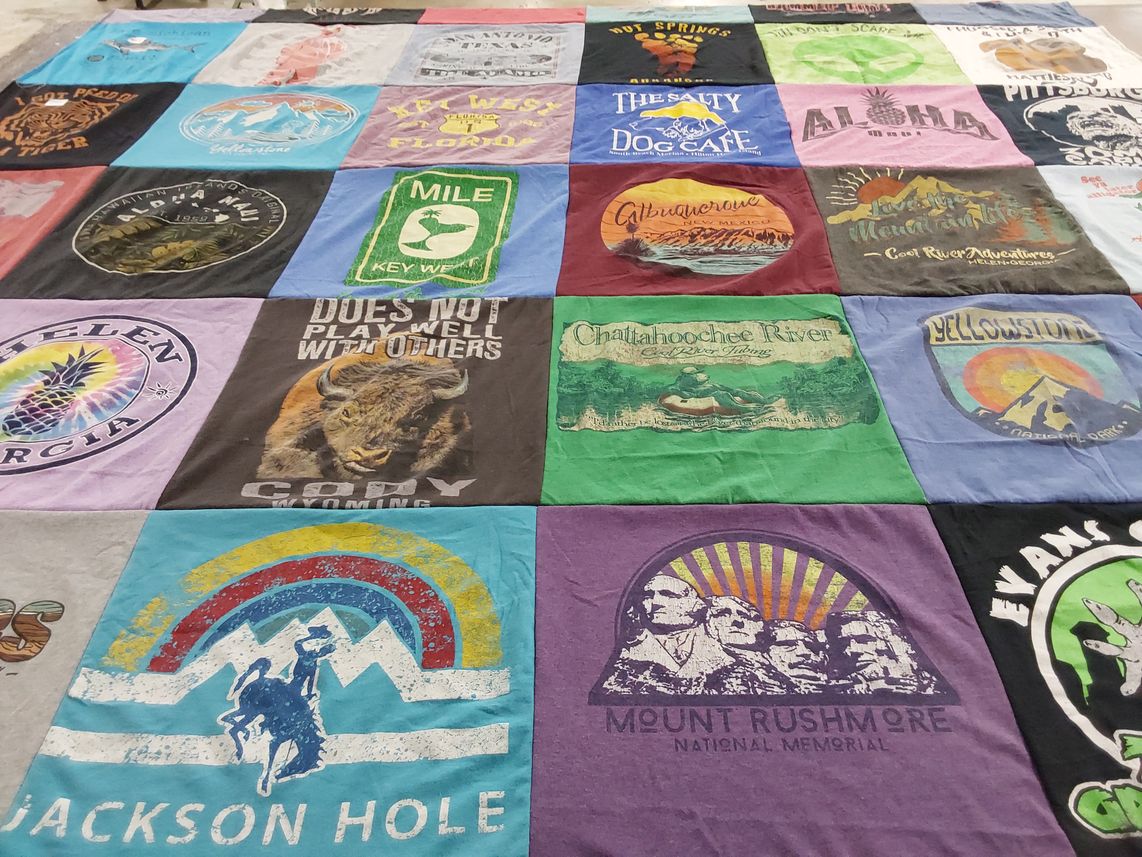 T-shirt quilt with travel, adventure themes by Heather from TN