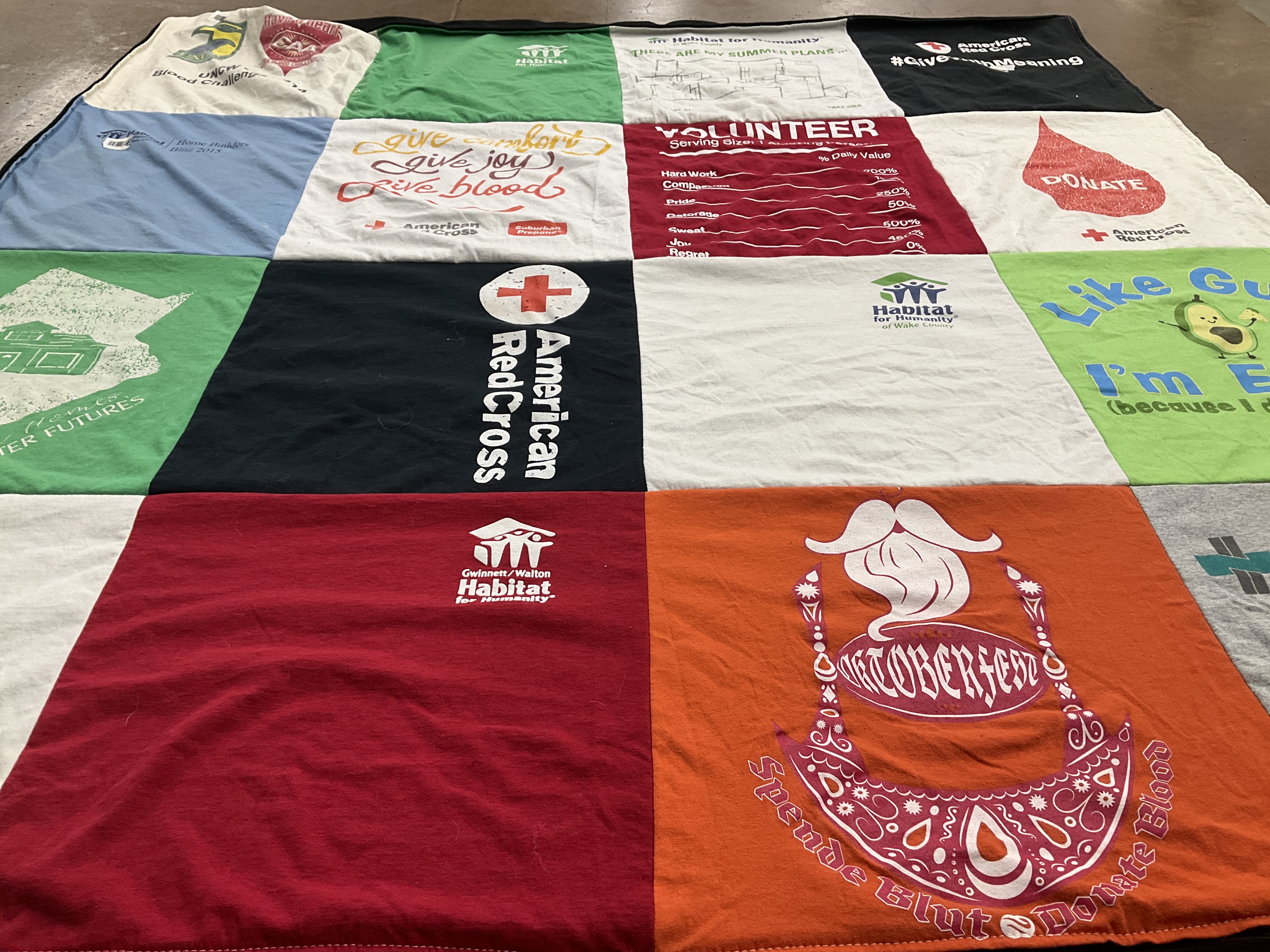 T-shirt quilt with community service, volunteering themes by Amanda from GA