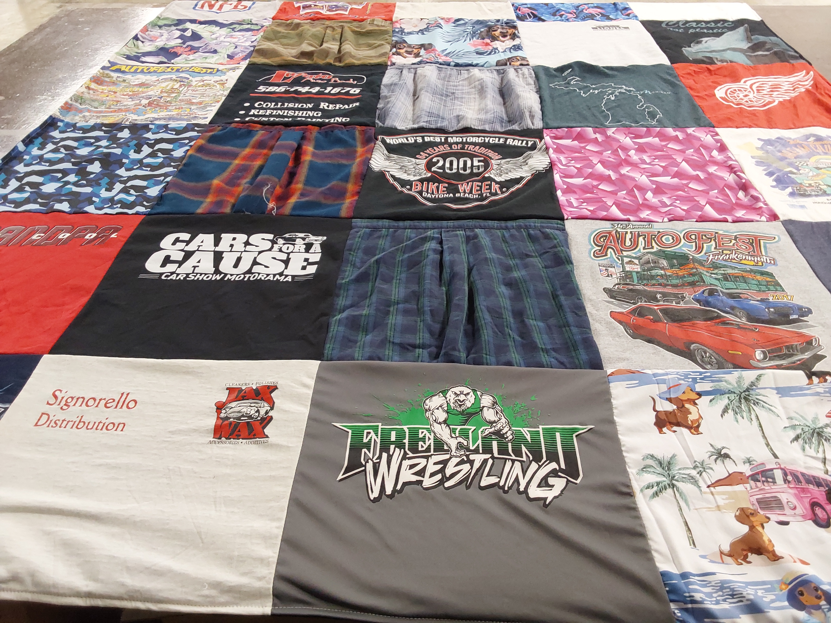 T-shirt quilt with motor shows, wrestling themes by Michelle from MI