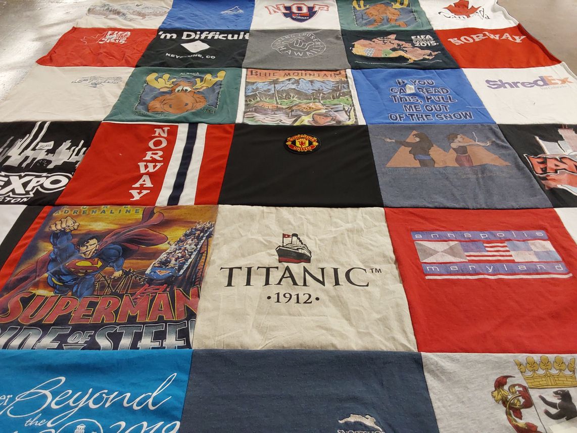 T-shirt quilt with travel, comics themes by Tara from FL
