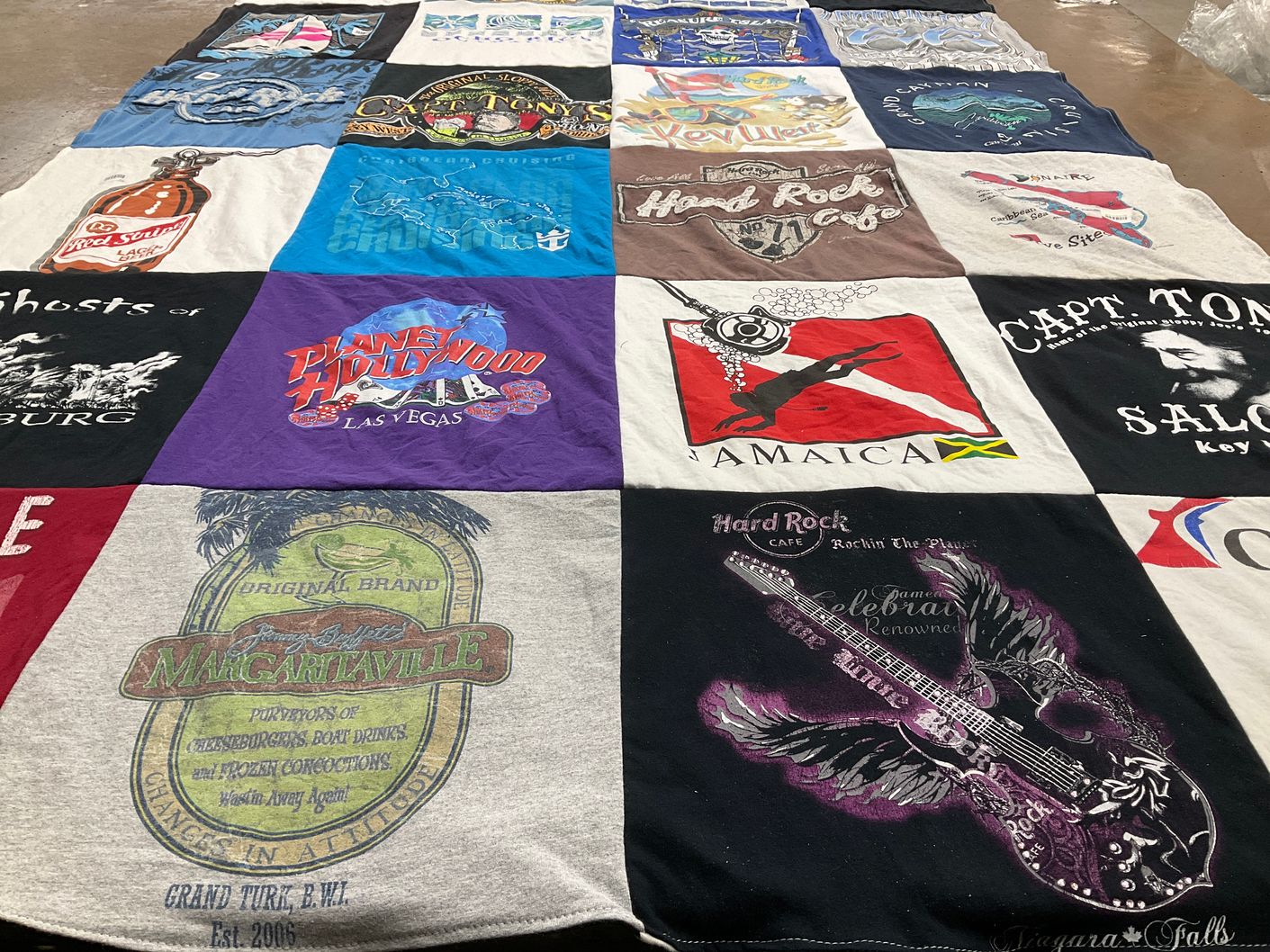 T-shirt quilt with travel, music themes by Linda from MI