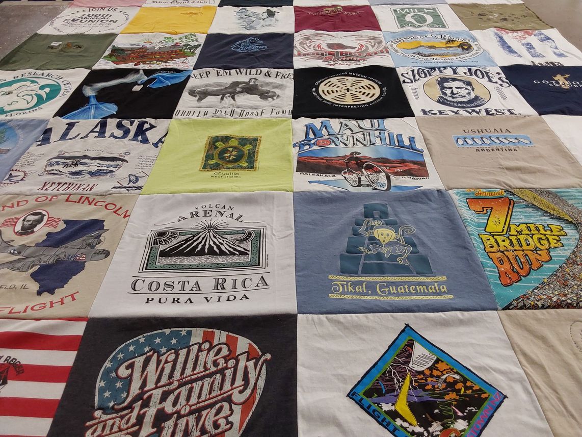 T-shirt quilt with travel, outdoor activities themes by Carol from IL