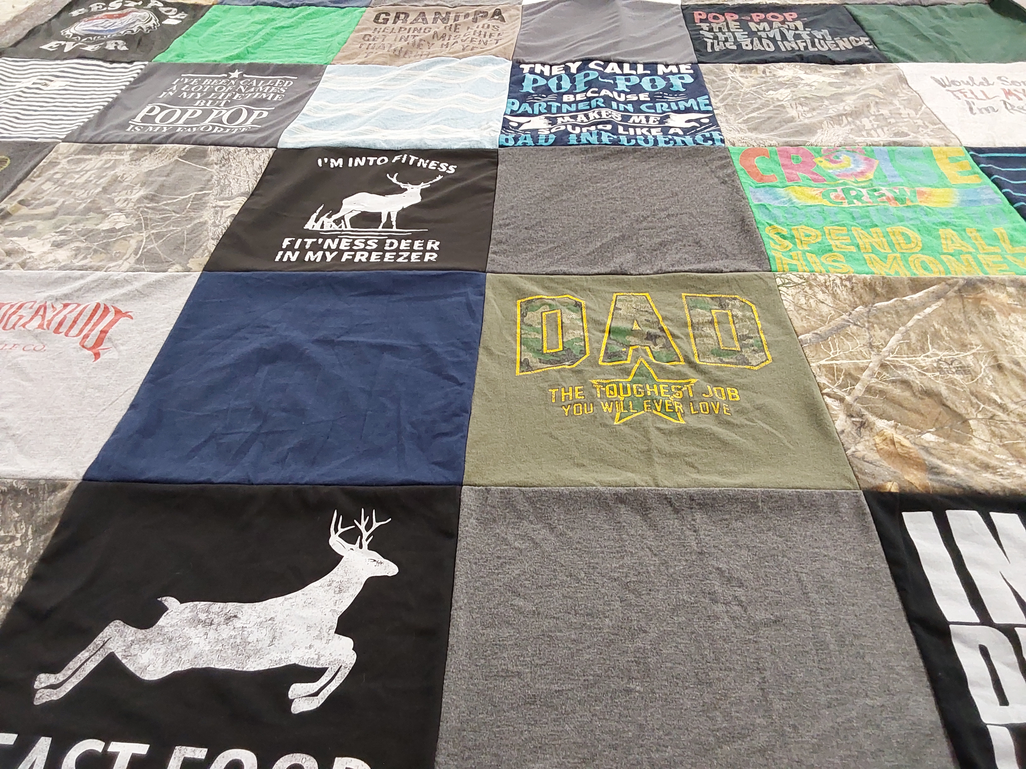 T-shirt quilt with fitness, hunting themes by Saundra from LA