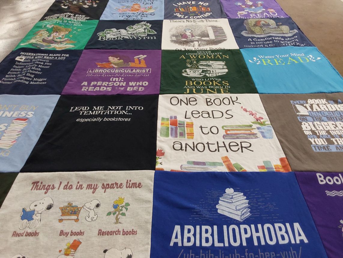 T-shirt quilt with reading, books themes by Sharon from MO