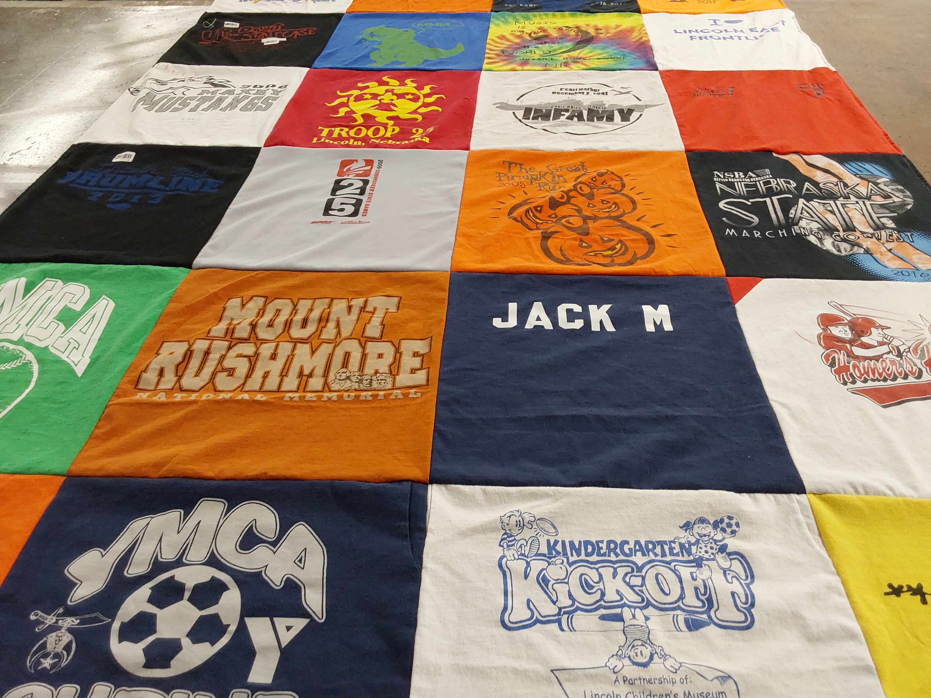 T-shirt quilt with football, music themes by Megan from NE