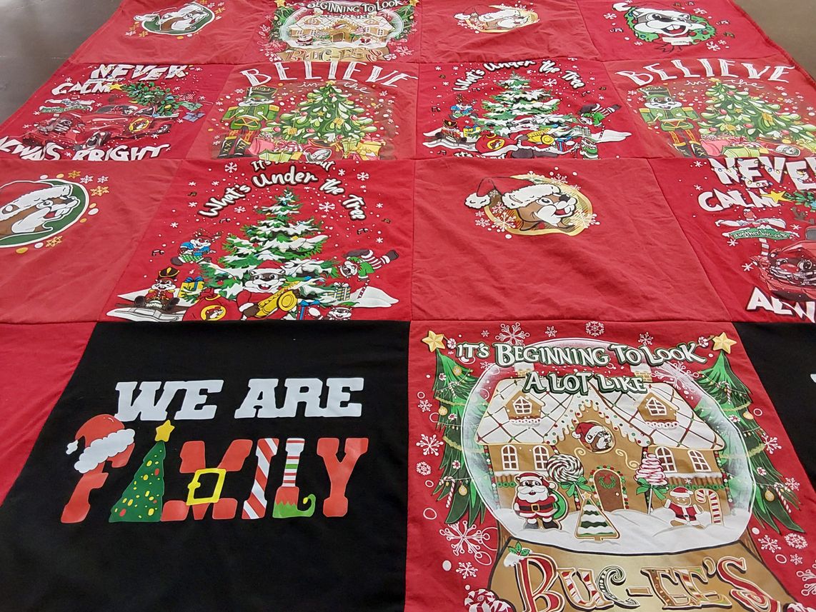 T-shirt quilt with christmas, family themes by Samantha from GA