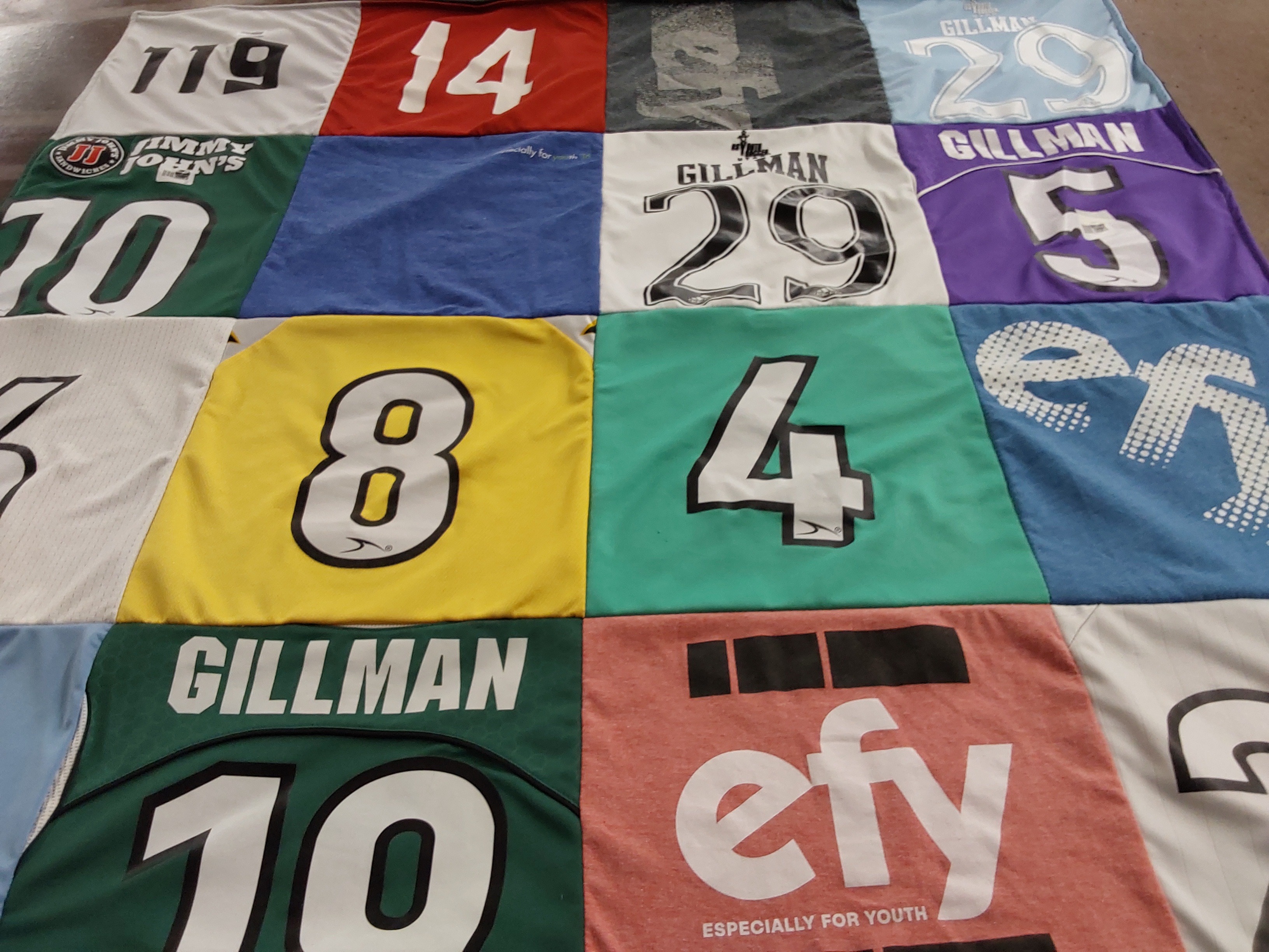 T-shirt quilt with sports, youth activities themes by Meg from UT