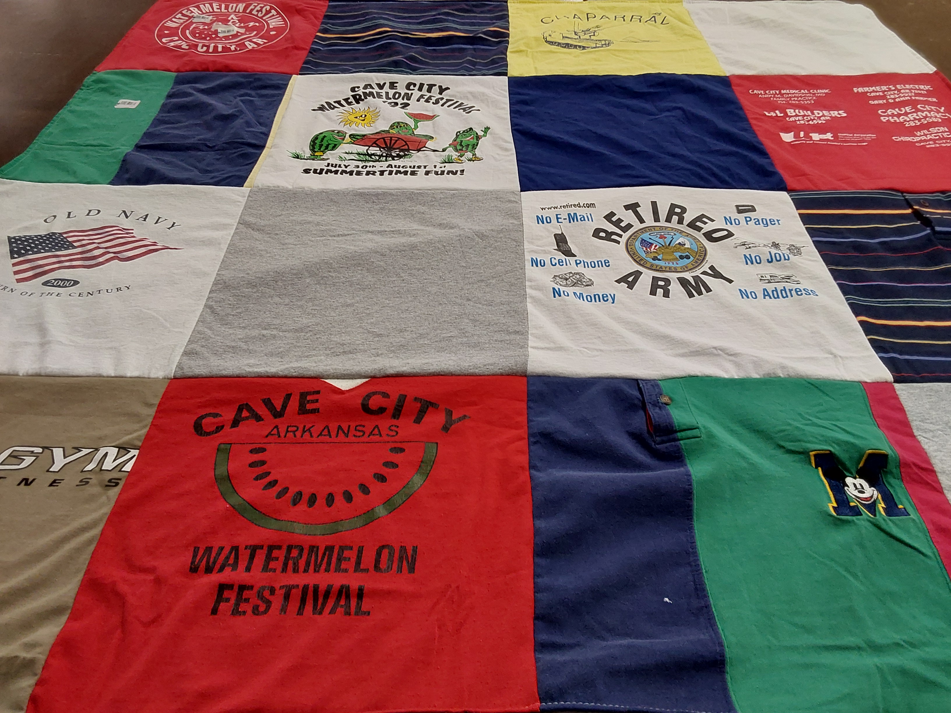 T-shirt quilt with local festivals, veteran support themes by Patricia from TX