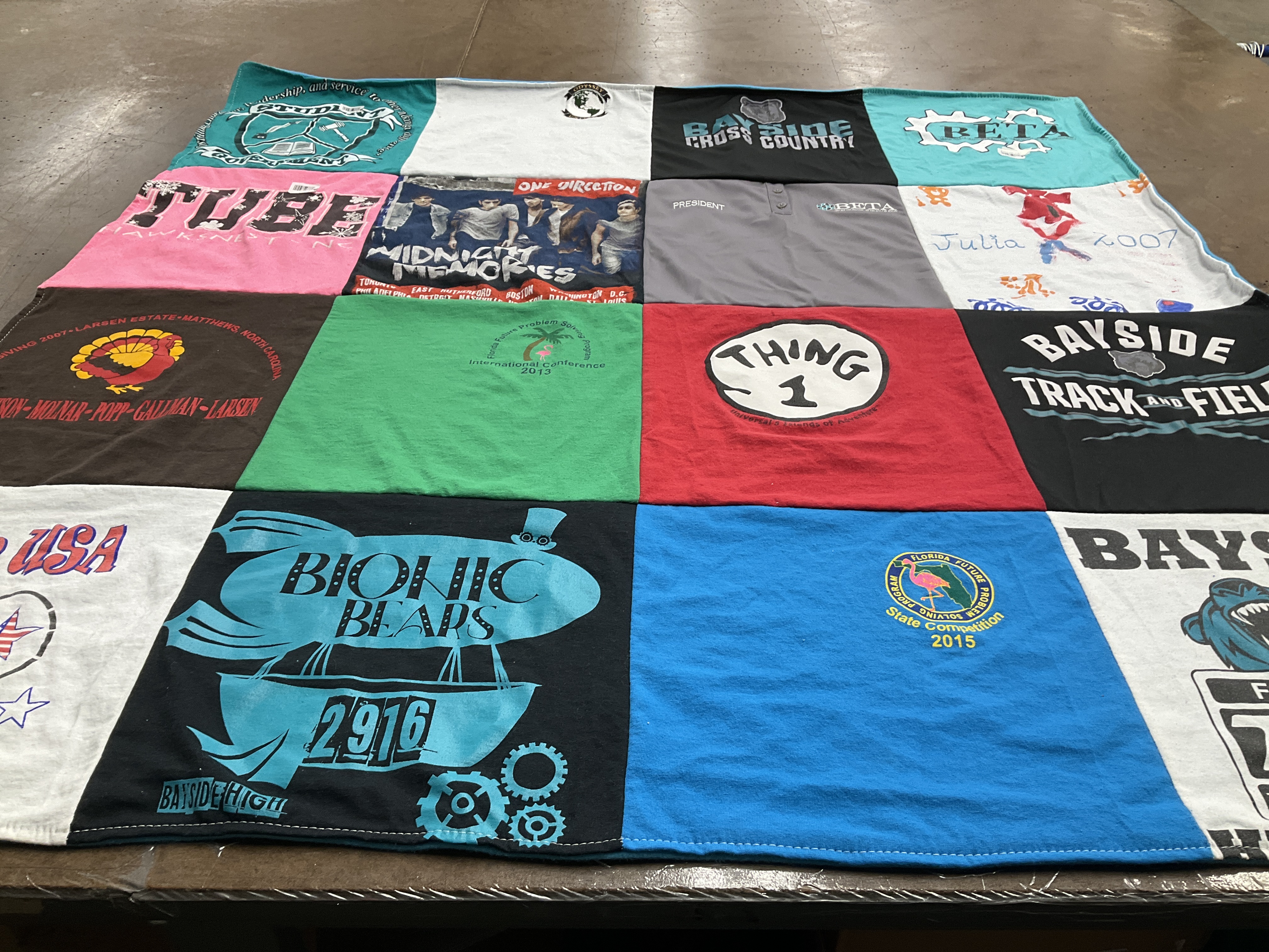 T-shirt quilt with sports, running themes by Stacy from FL