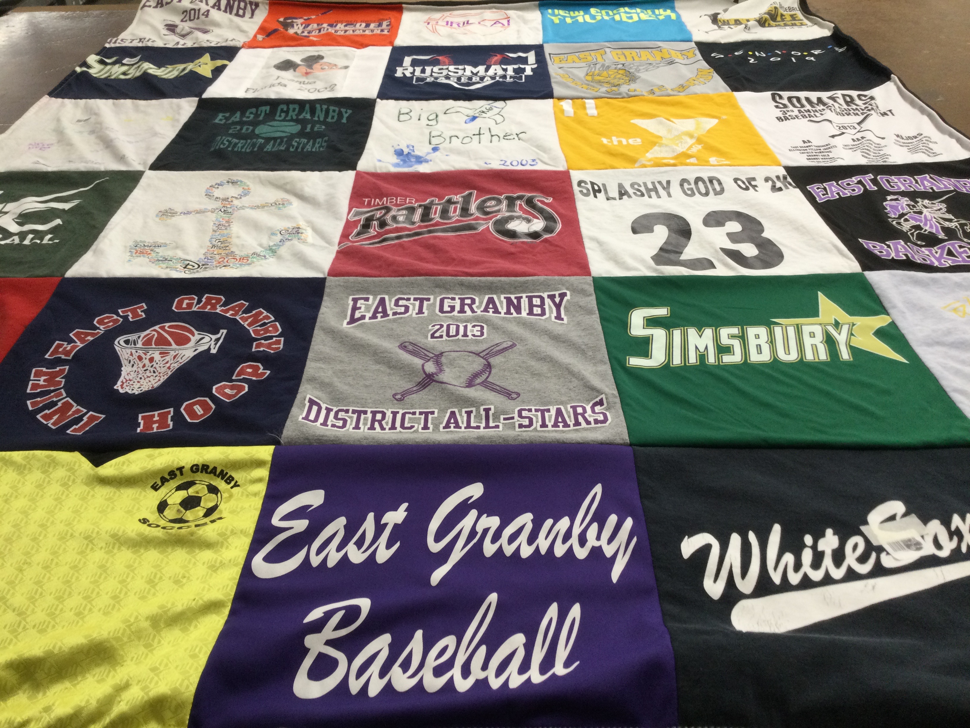 T-shirt quilt featuring timber rattlers, east granby basketball by Jen from CT