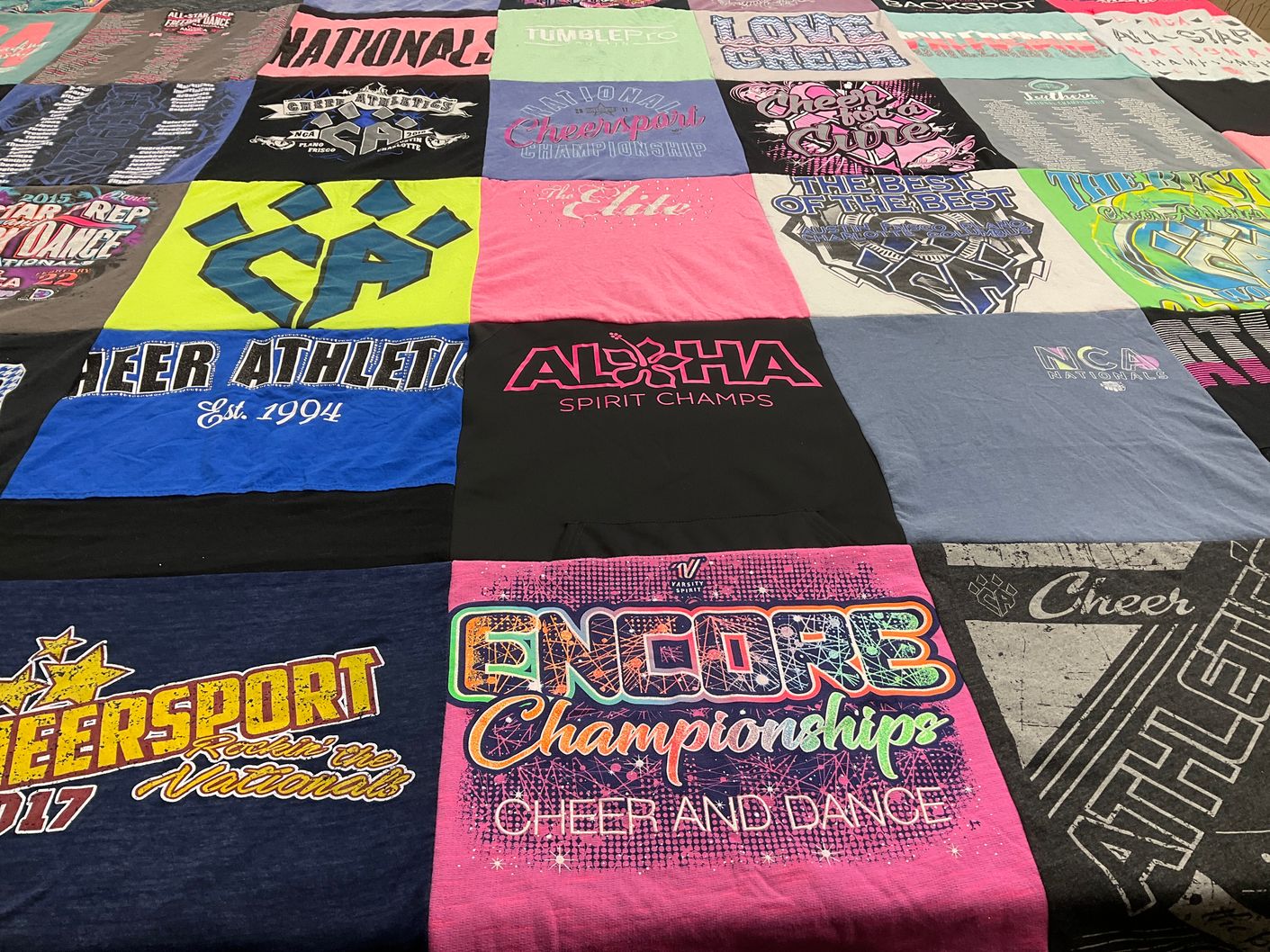 T-shirt quilt with cheerleading, dance themes by Cindy from TX
