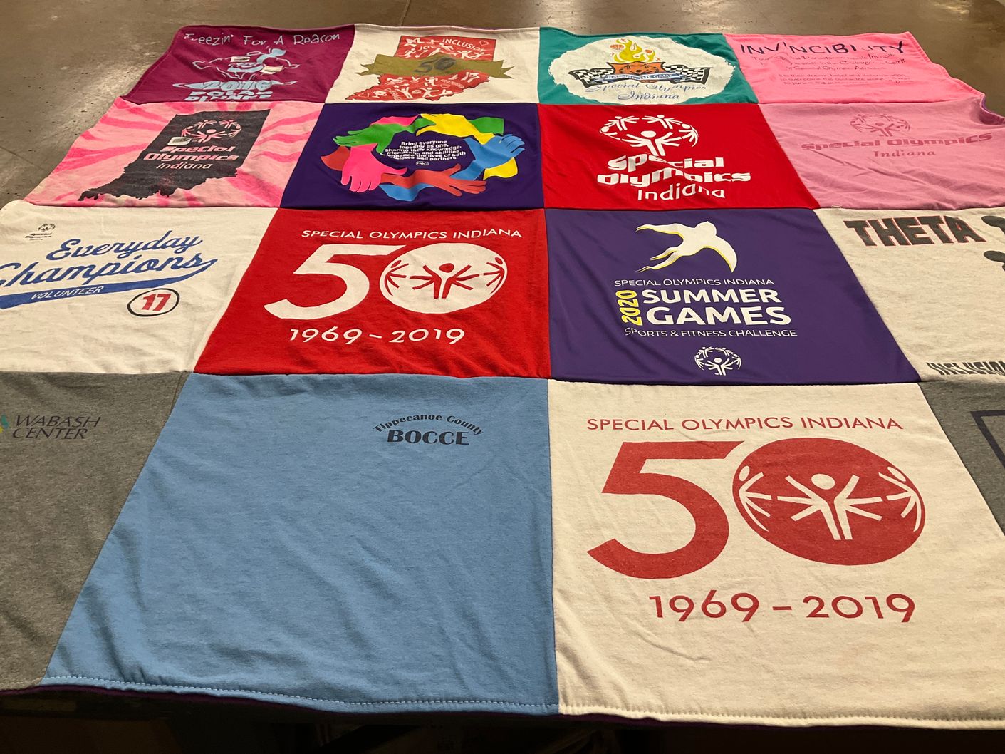 T-shirt quilt with sports, fitness themes by Jennifer from IN