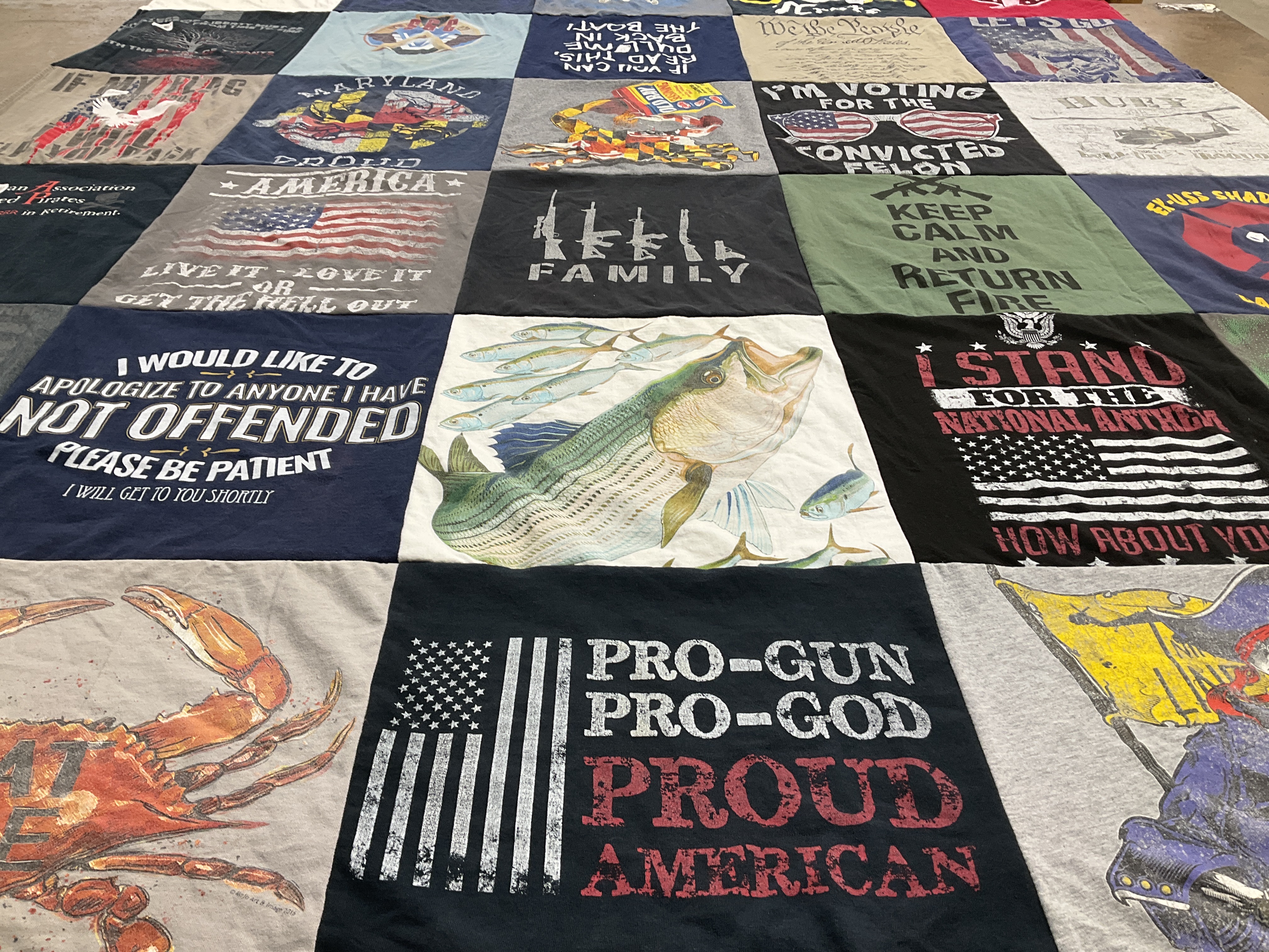 T-shirt quilt with hunting, fishing themes by Alexis from MD