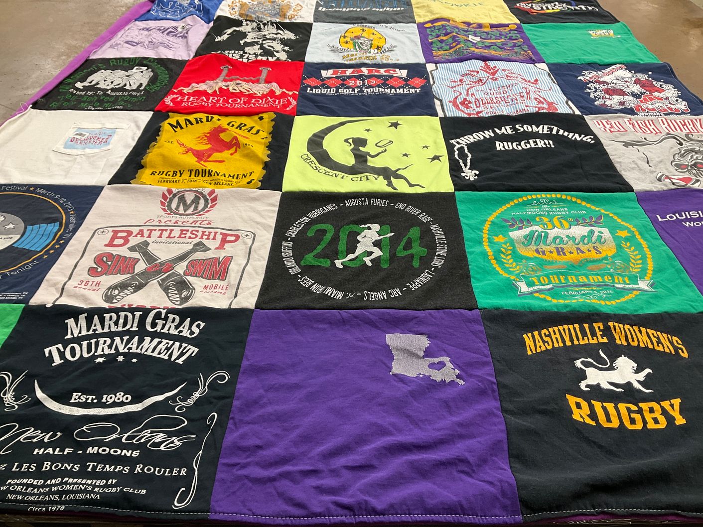 T-shirt quilt with rugby, mardi gras themes by Molly from OH