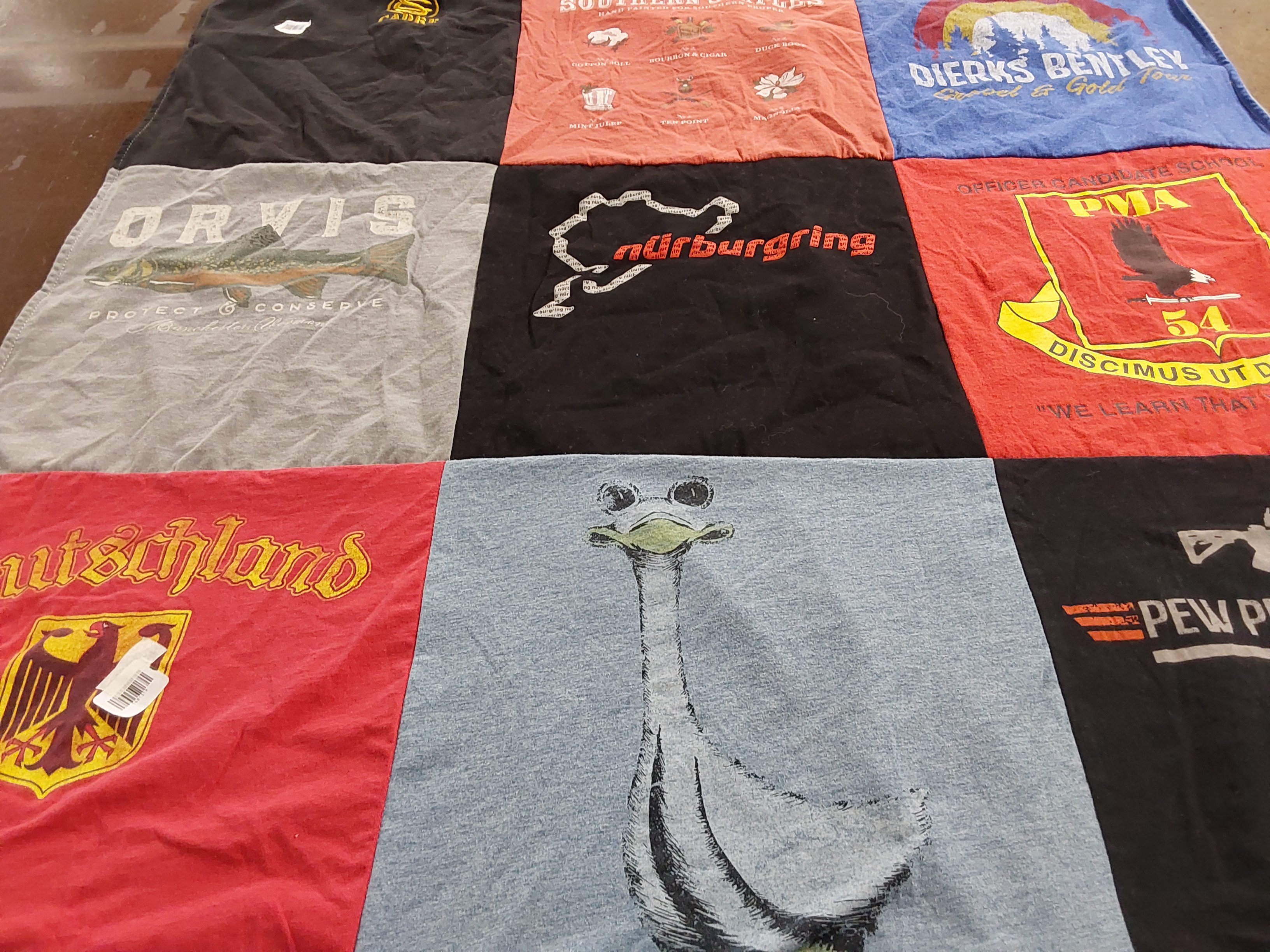 T-shirt quilt with fishing, automotive themes by Monique from SC
