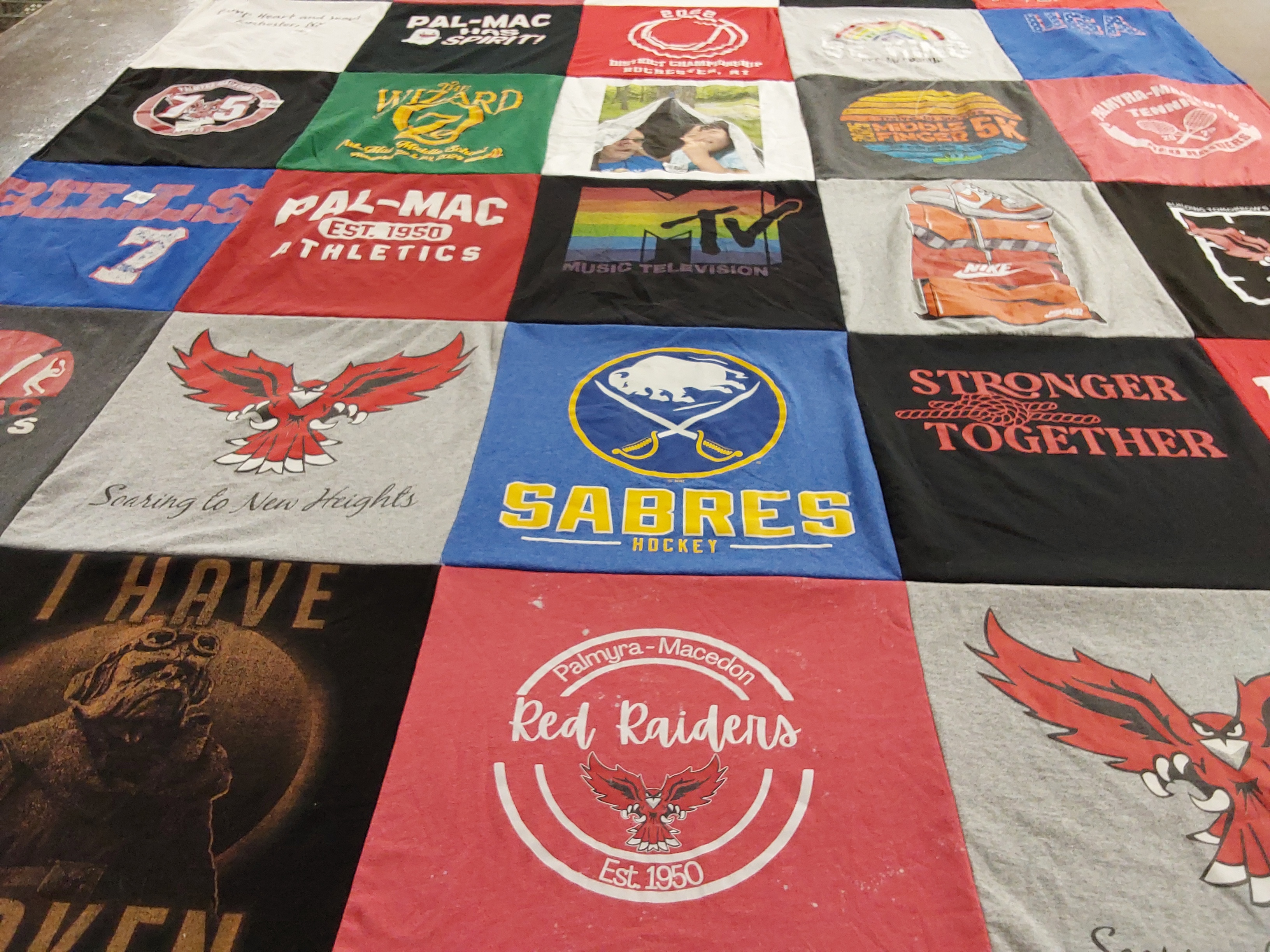 T-shirt quilt featuring sabre hockey team, red raiders by Kristin from NY