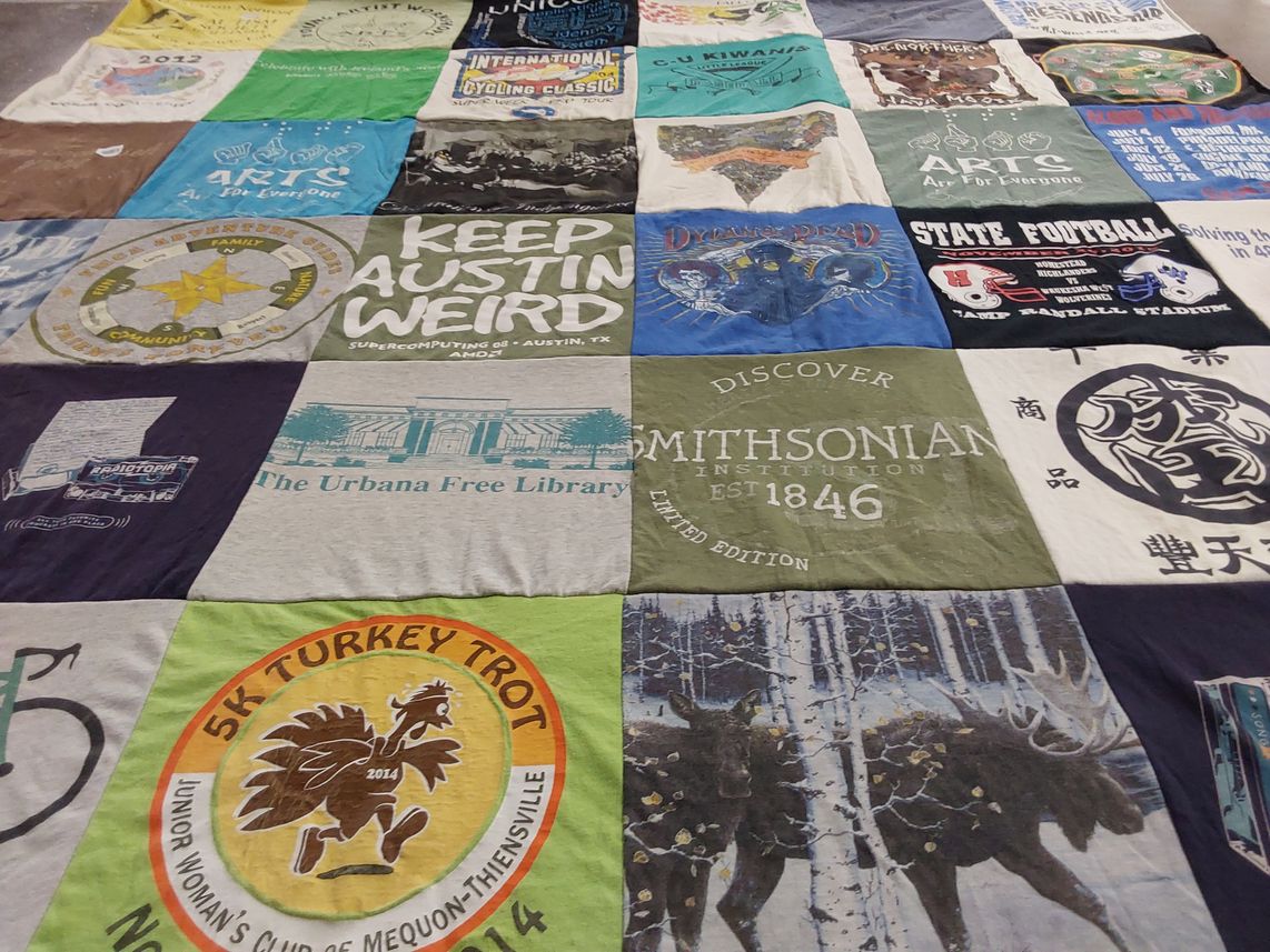 T-shirt quilt with cycling, community service themes by Michael A from WI