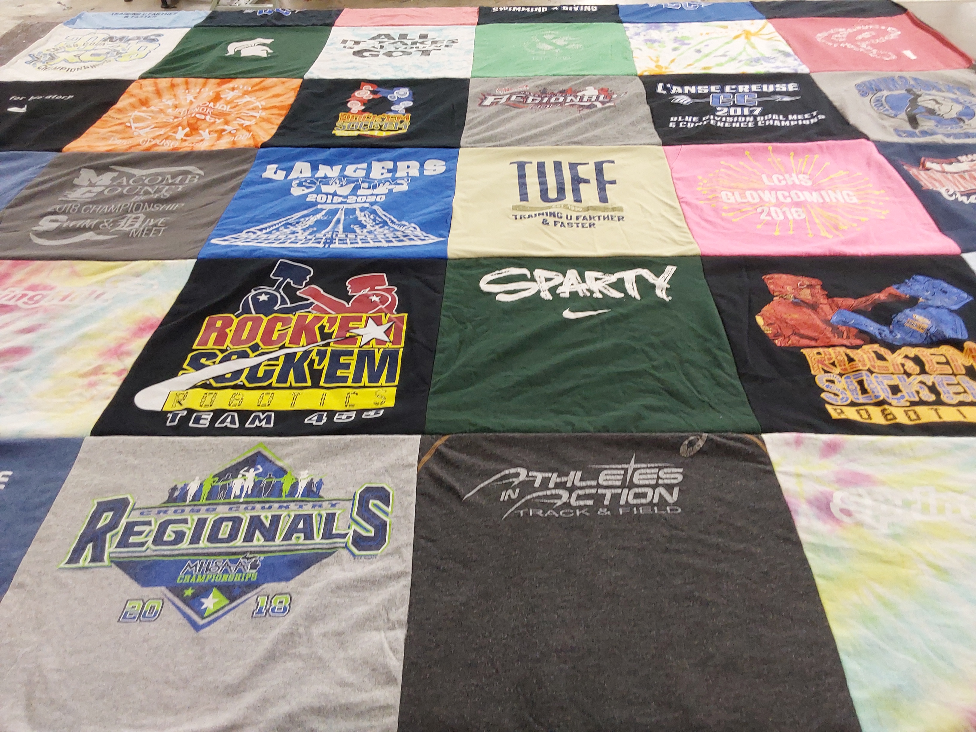 T-shirt quilt featuring lancers swim team by Gretchen from MI