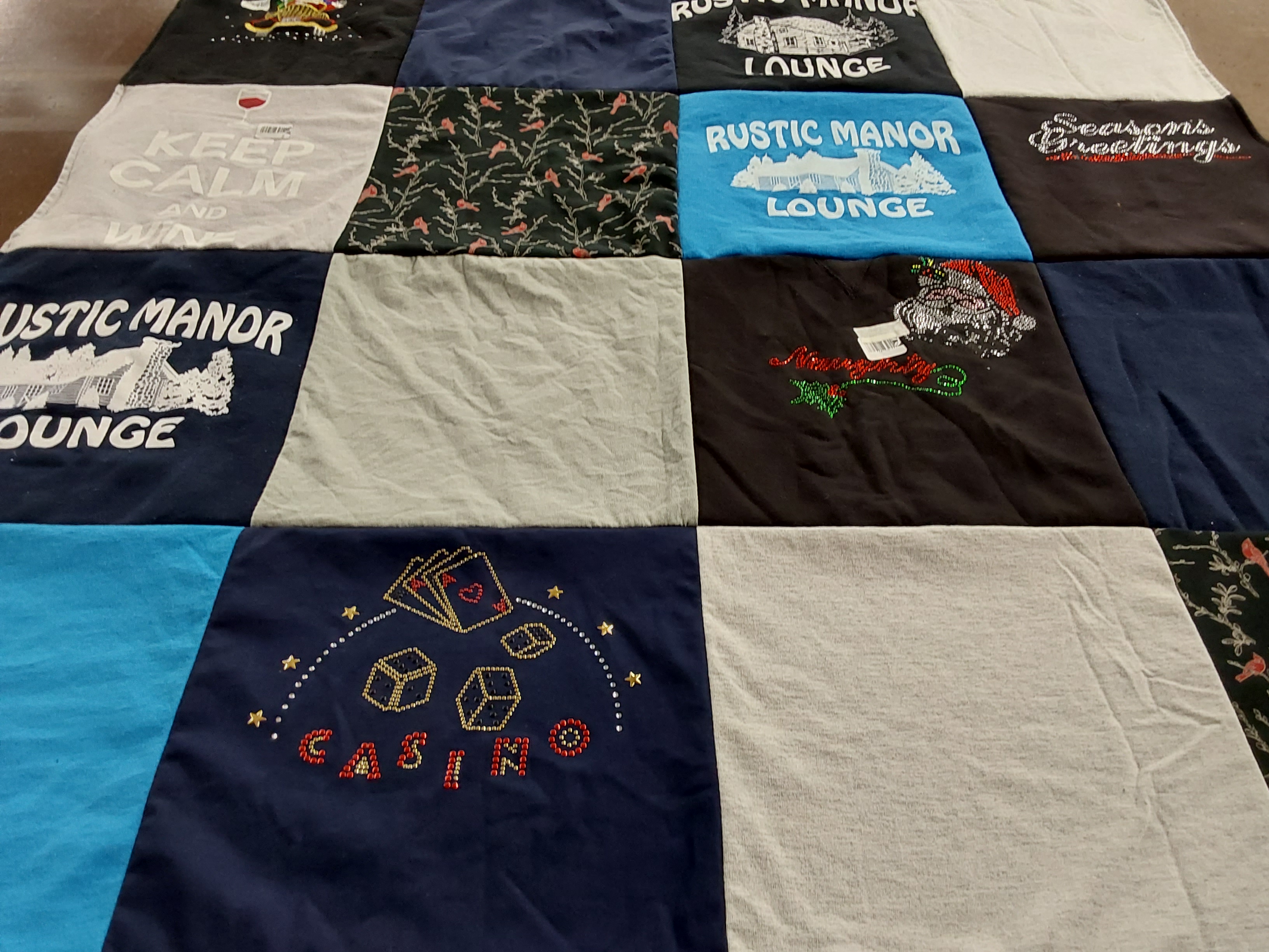 T-shirt quilt with casinos, lounges themes by NANCY from MI