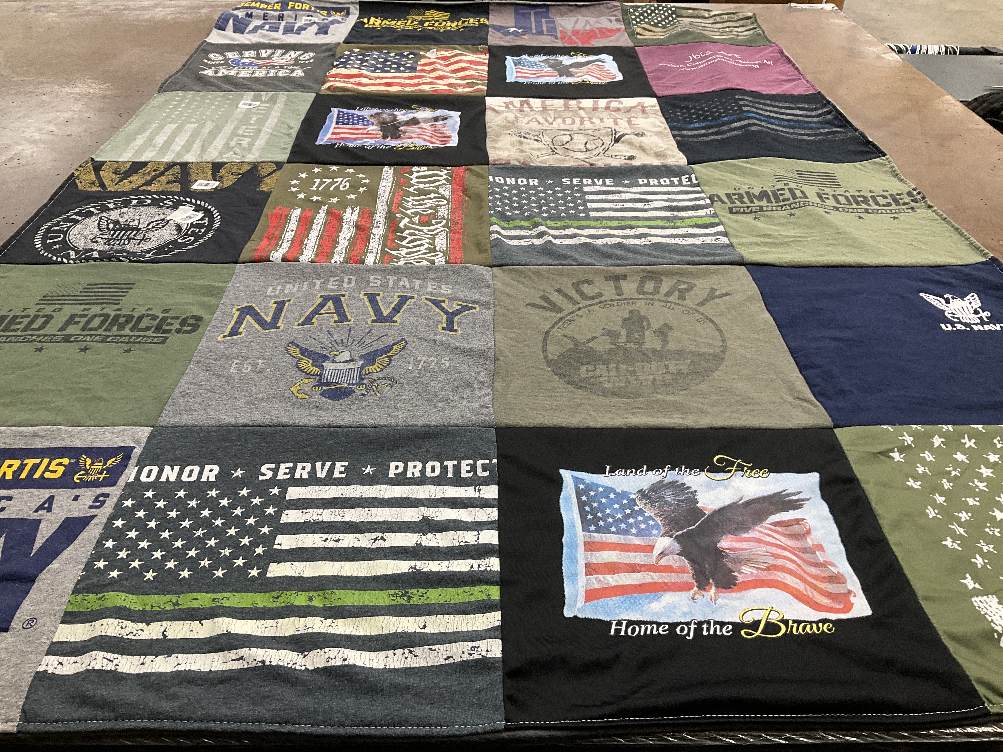 T-shirt quilt with military service, patriotism themes by Andre from NY