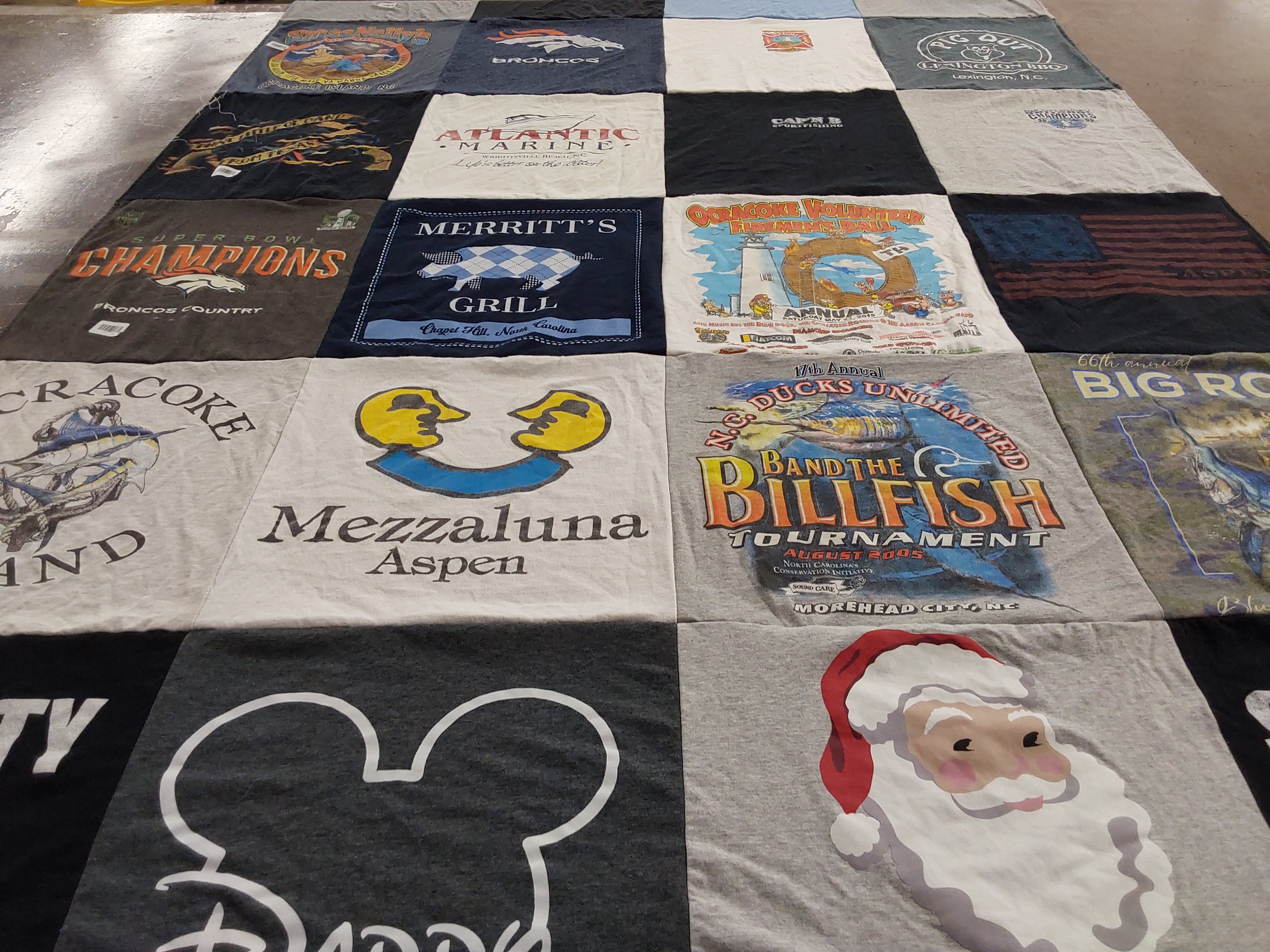 T-shirt quilt with fishing, dining themes by Parker from NC