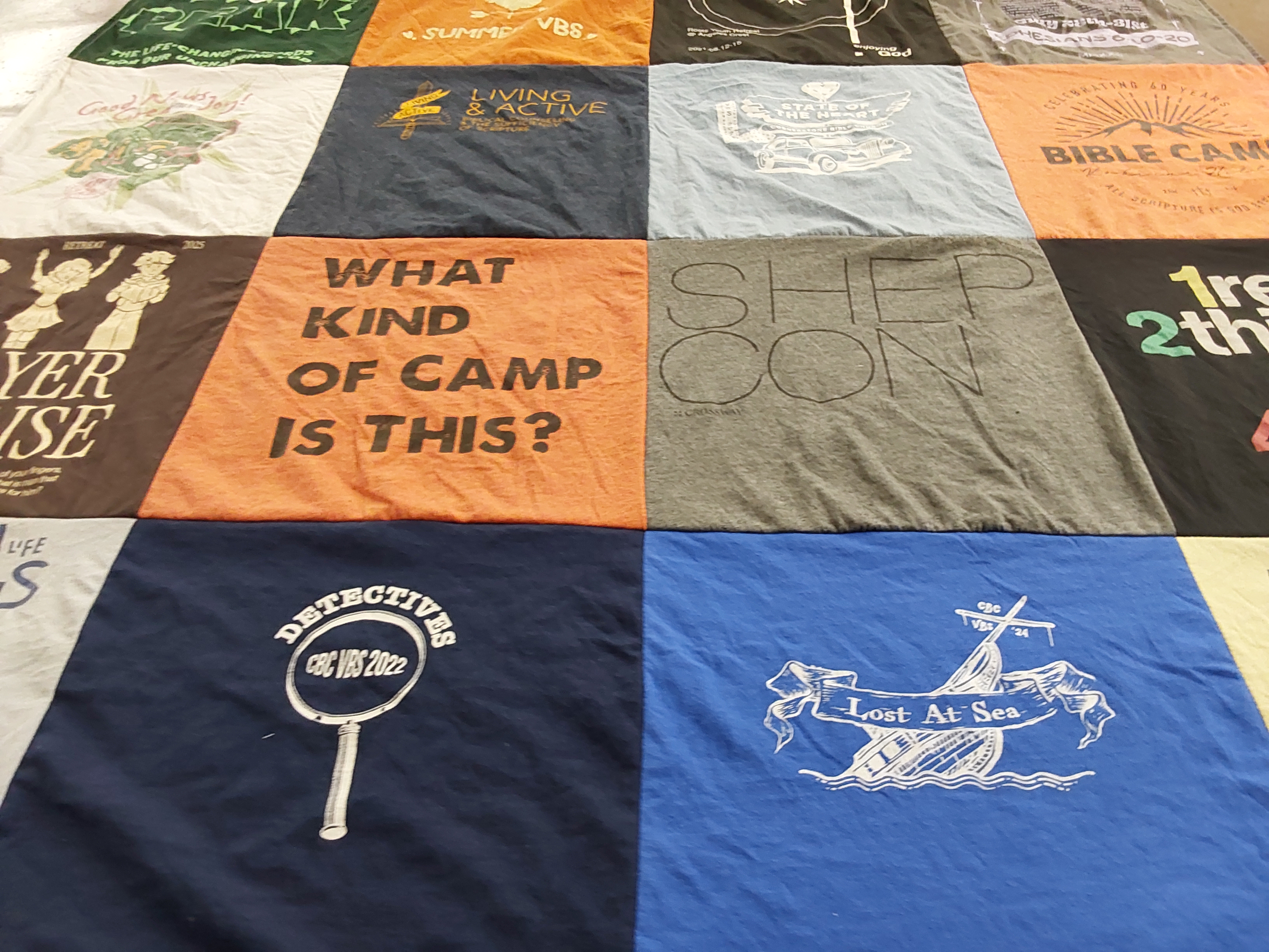 T-shirt quilt with summer camp, bible study themes by Clifton from CA