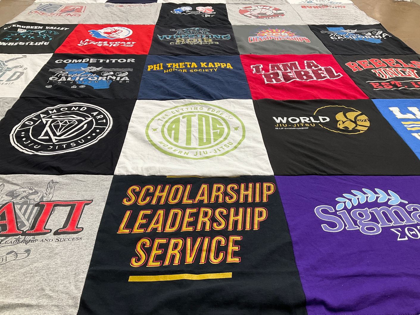 T-shirt quilt with jiu jitsu, wrestling themes by Michelle from CA