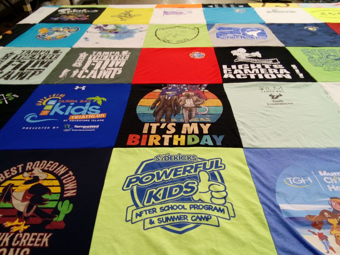T-shirt quilt with sports, youth programs themes by Andrea from FL
