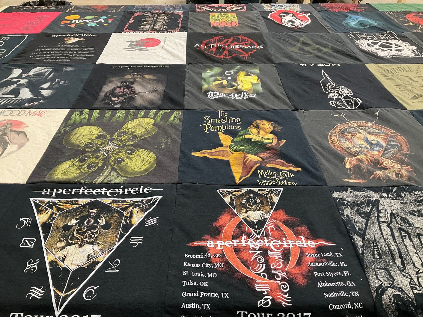 T-shirt quilt with rock music, music festivals themes by Rebekah from TX