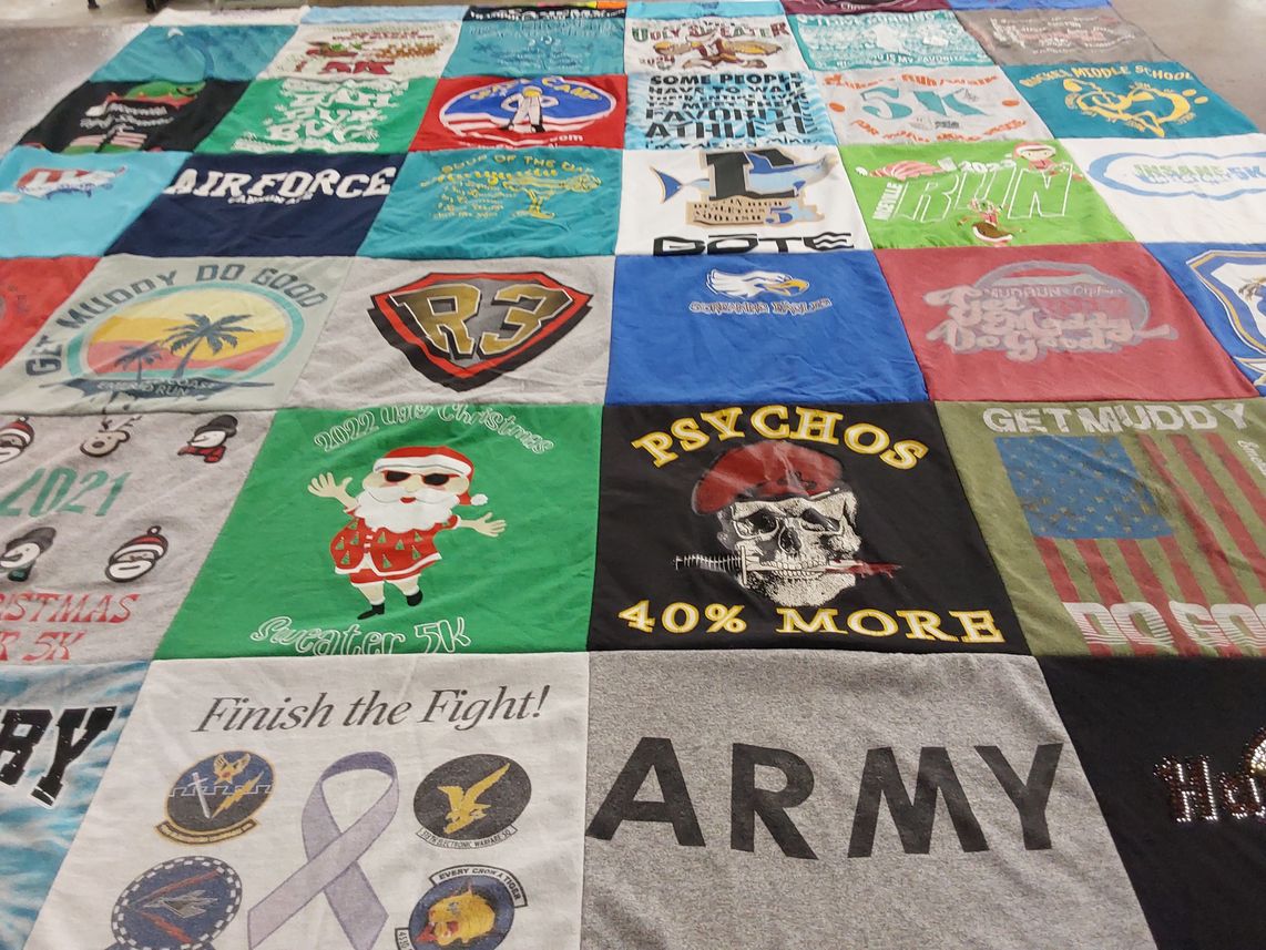 T-shirt quilt with running, military themes by Christina from FL