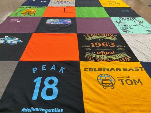 T-shirt quilt with charity, community service themes by Sheila from NJ