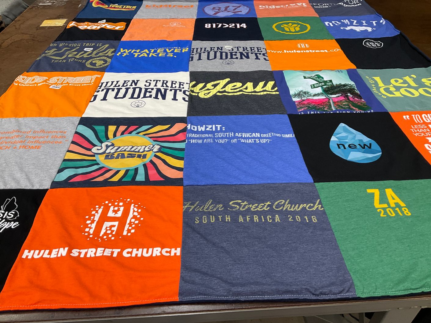 T-shirt quilt with community, youth themes by Lesley from TX