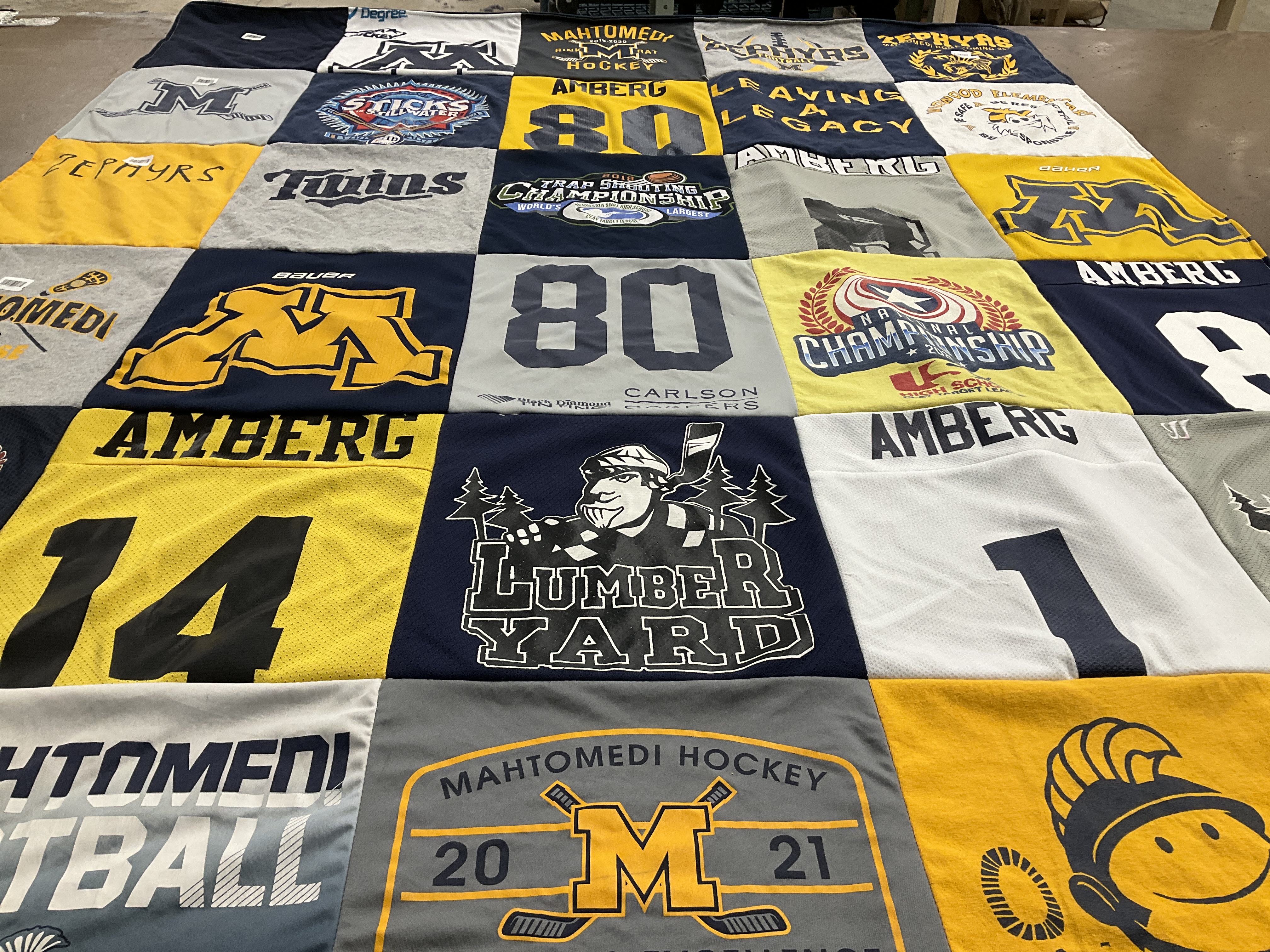 T-shirt quilt featuring mahtomedi football team, mahtomedi hockey team by Sara from MN