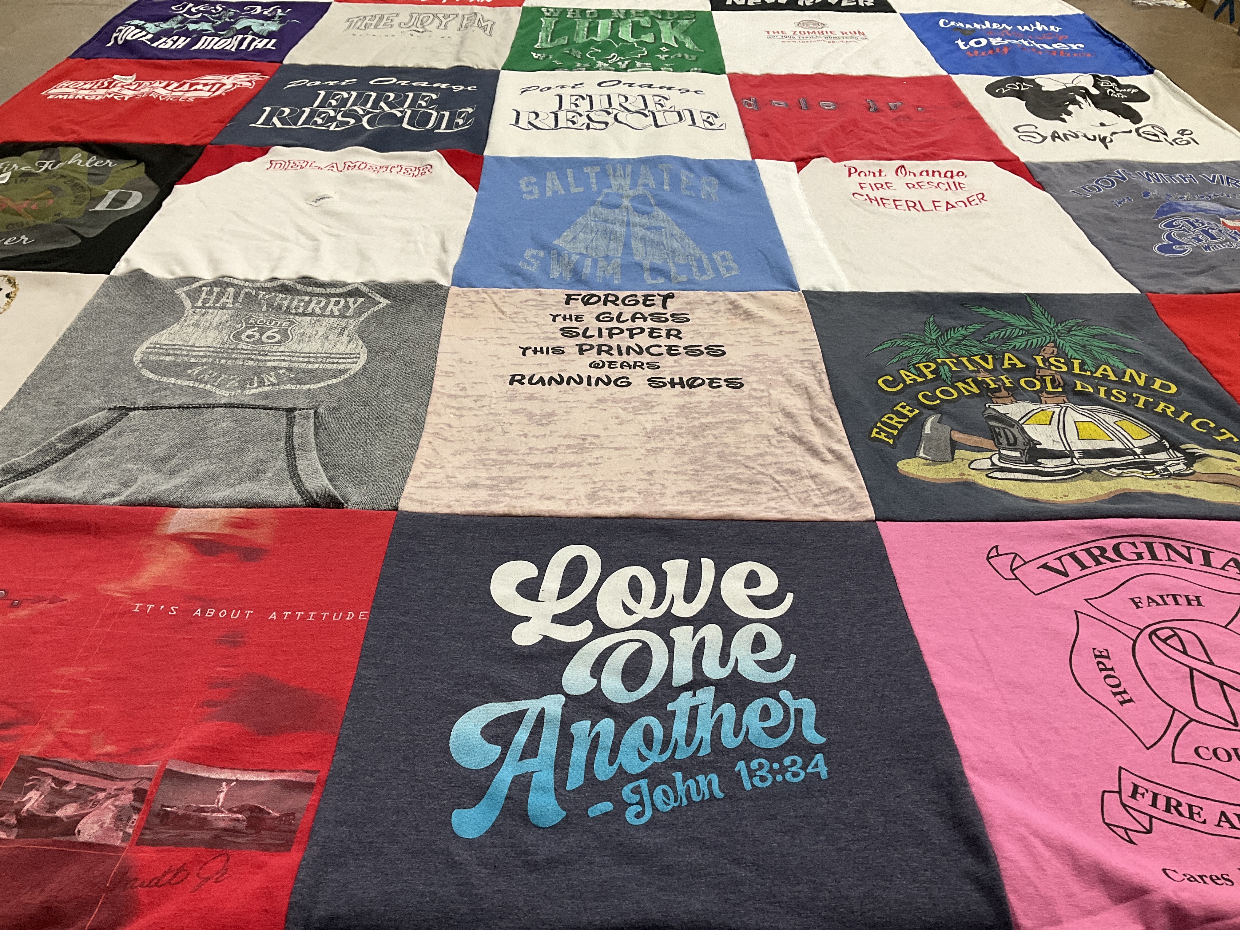 T-shirt quilt with firefighting, community service themes by Sandra from FL