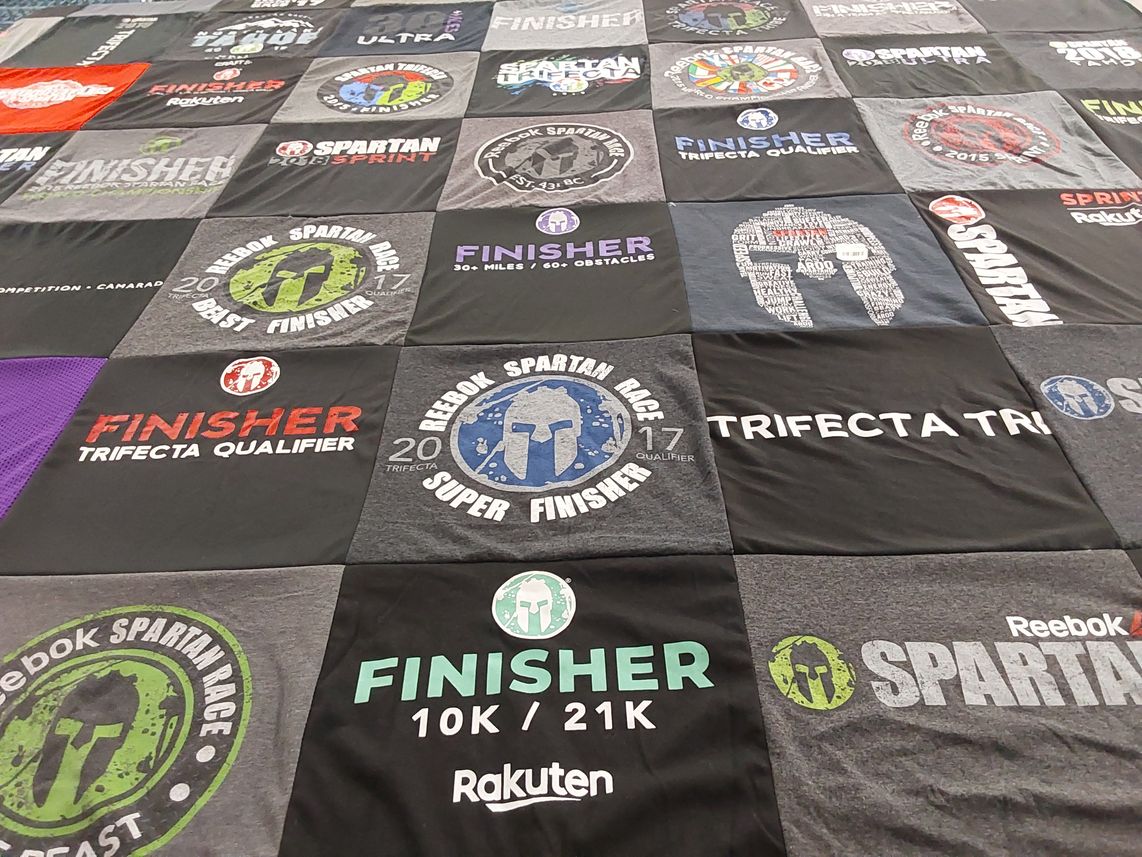 T-shirt quilt with obstacle course racing, fitness themes by Kristin from CA