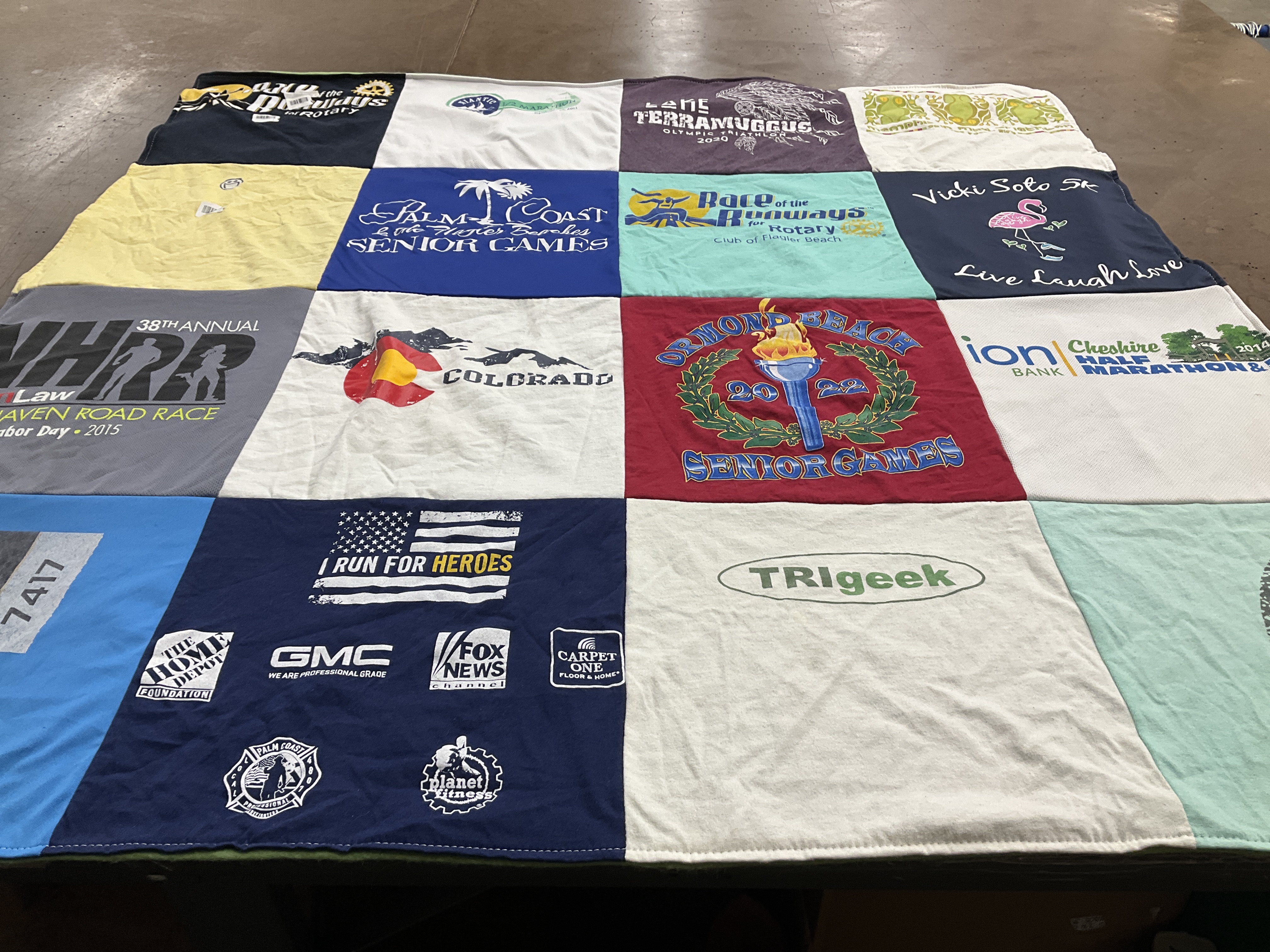 T-shirt quilt with running, sports themes by Laura from NJ