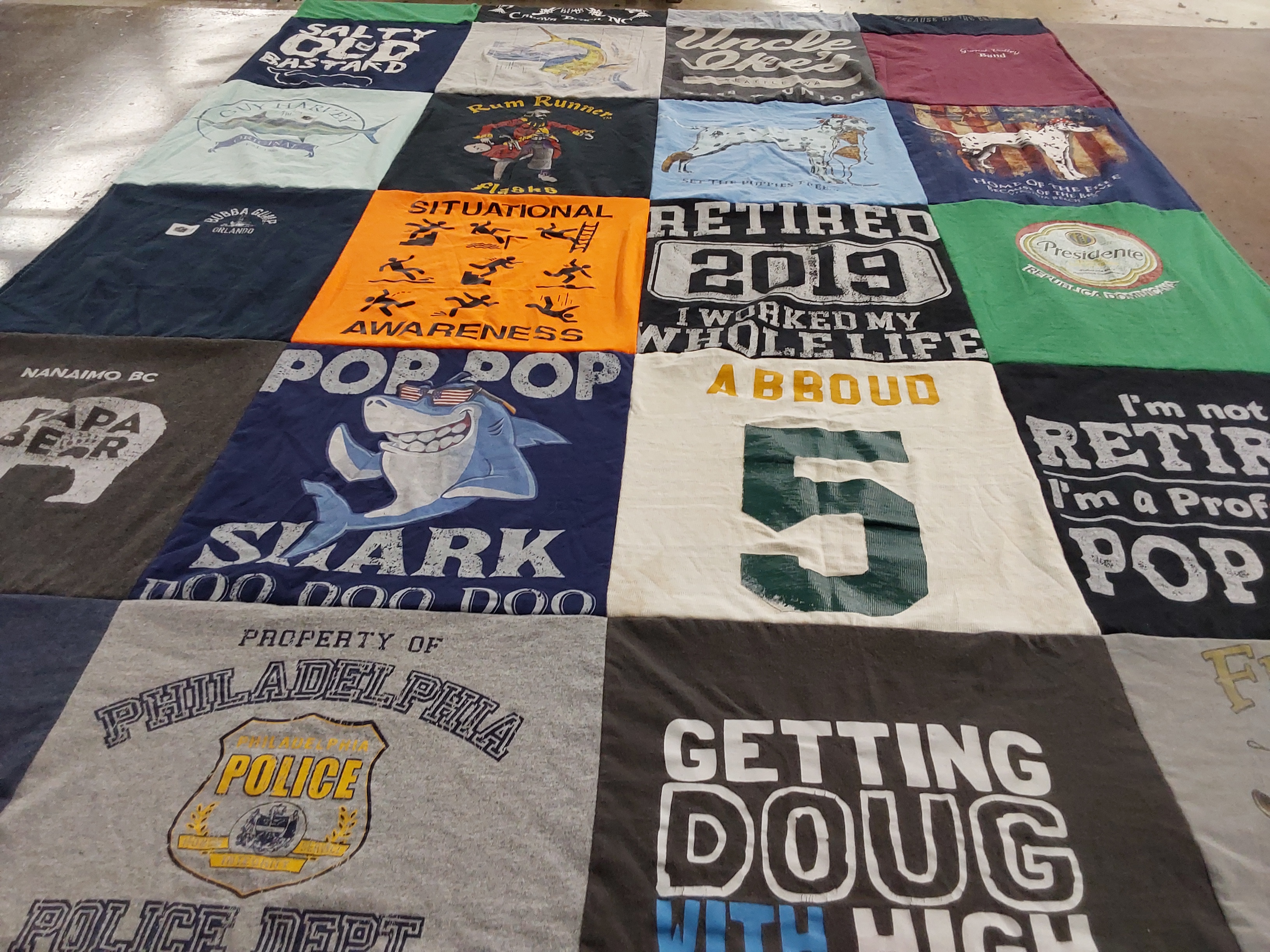 T-shirt quilt with retirement, police themes by Linda from PA