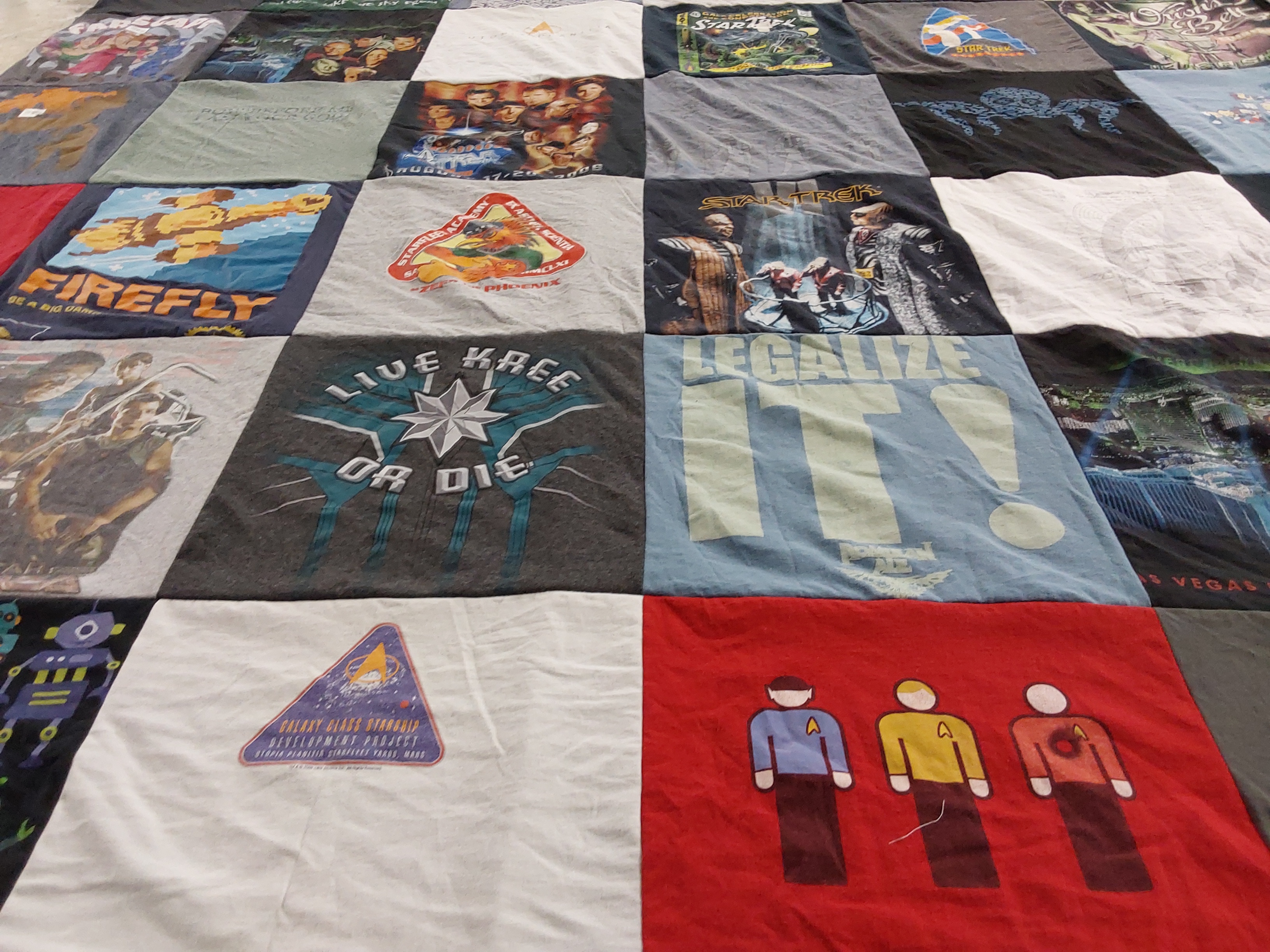 T-shirt quilt with science fiction, comics themes by Carol from IL