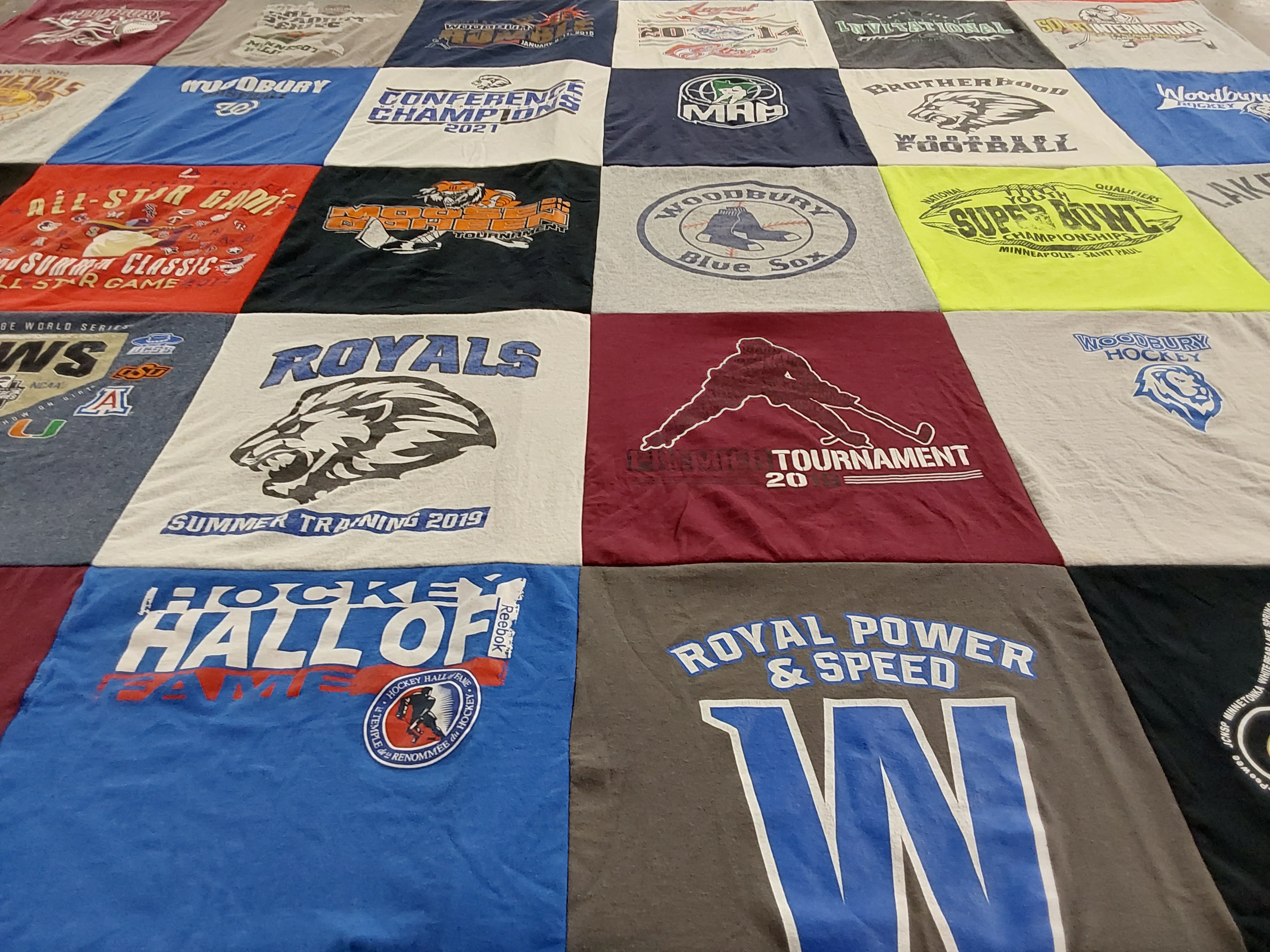 T-shirt quilt featuring woodbury blue sox, royals football by Jill from MN