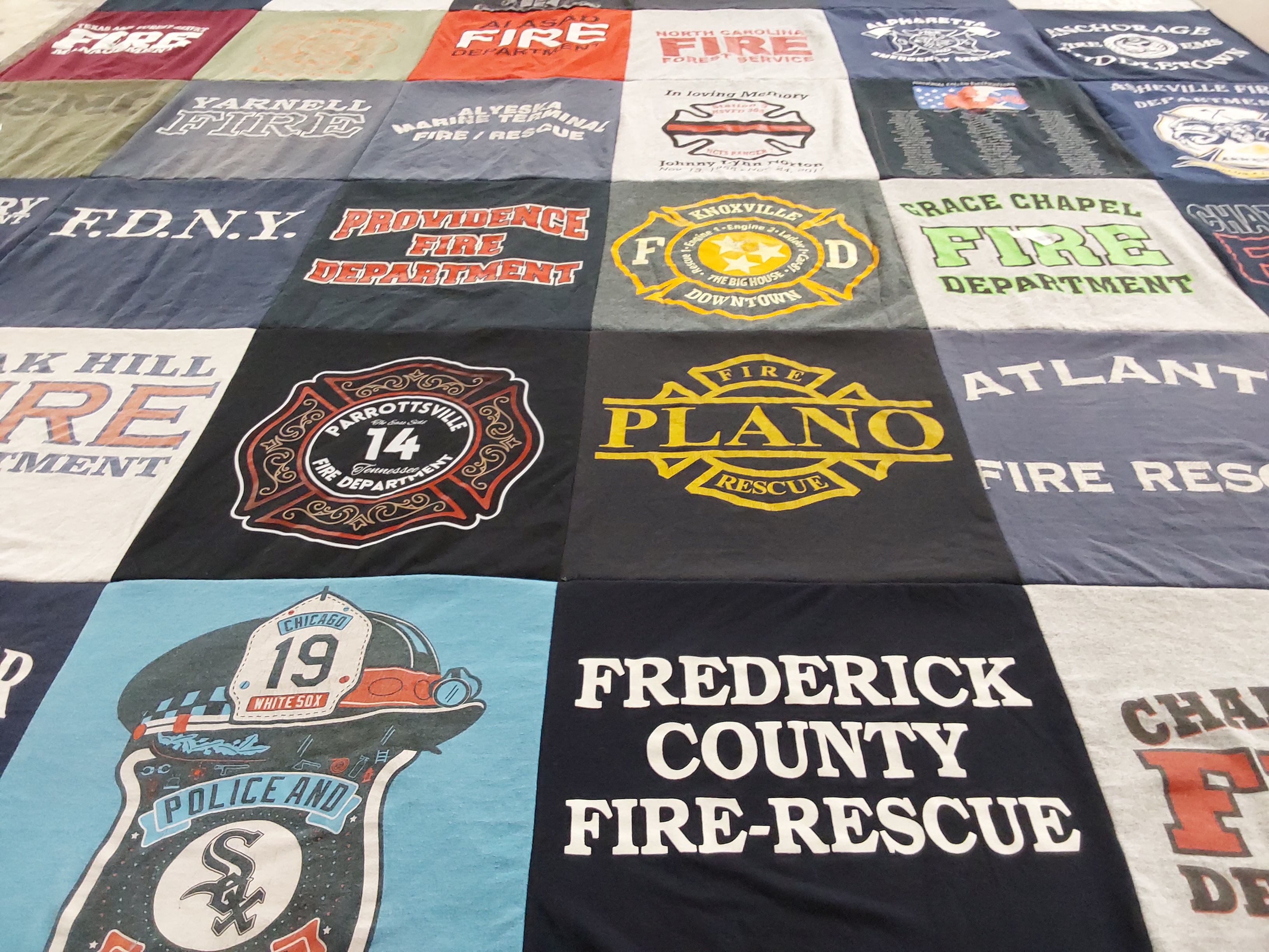 T-shirt quilt with firefighting, emergency services themes by Joshua from NC