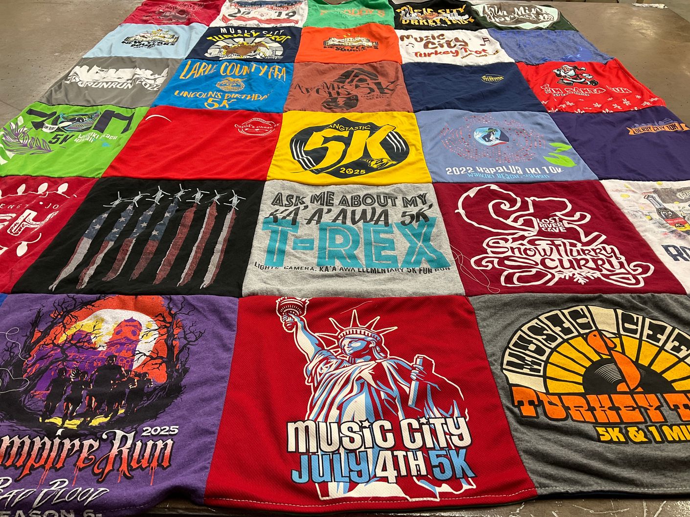 T-shirt quilt with running, community events themes by Sara from TN
