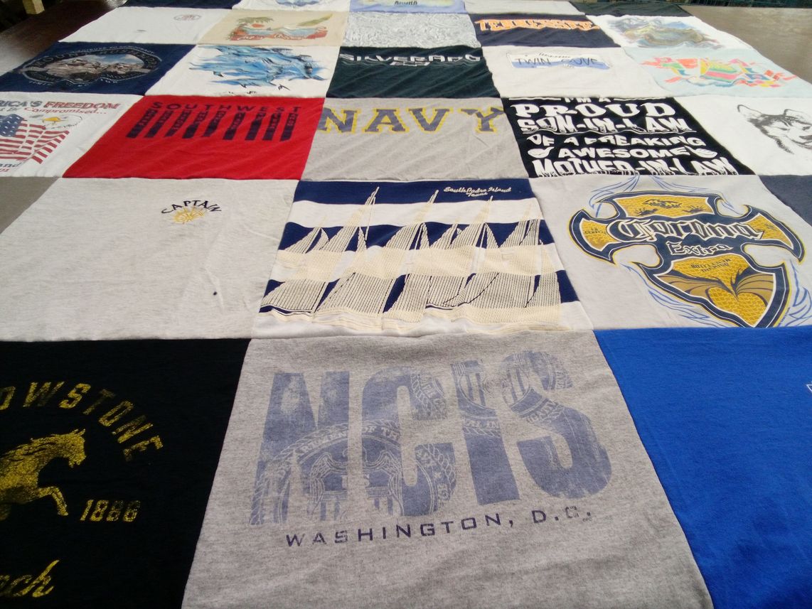 T-shirt quilt with navy, travel themes by Carolyn from SC