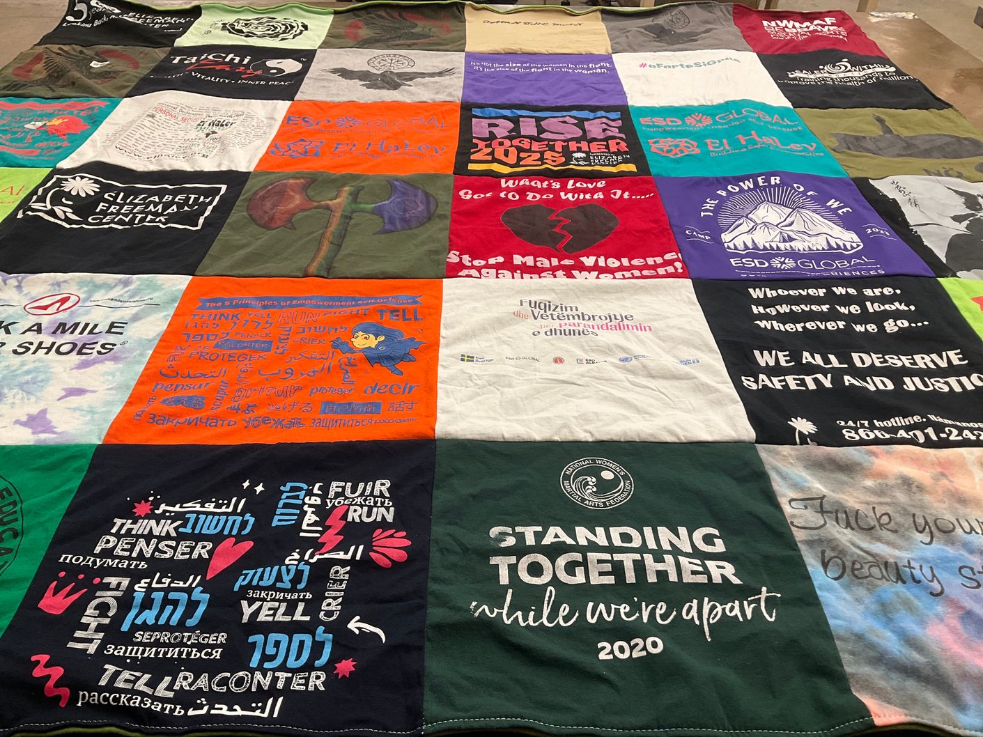 T-shirt quilt with social justice, safety advocacy themes by Kim from MA
