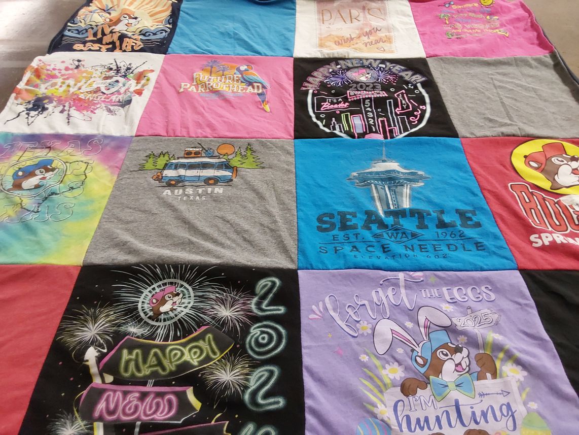 T-shirt quilt with travel, celebrations themes by Krystina from GA
