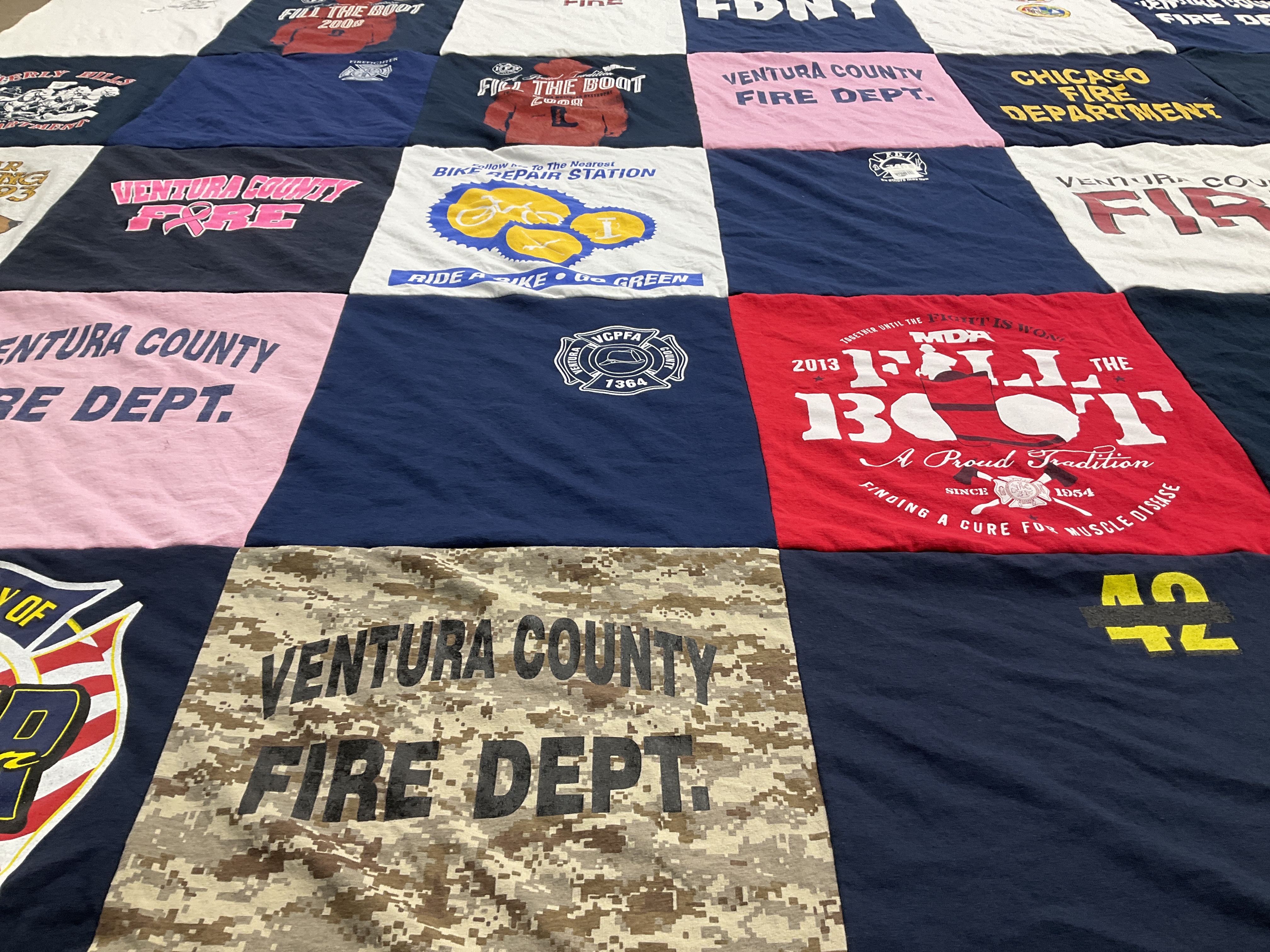 T-shirt quilt with firefighting, community service themes by Diana from CA