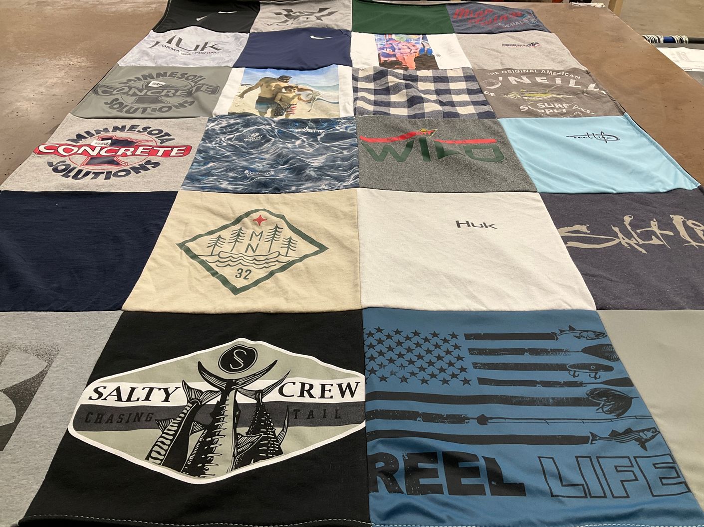 T-shirt quilt with fishing, outdoors themes by Maggie from MN