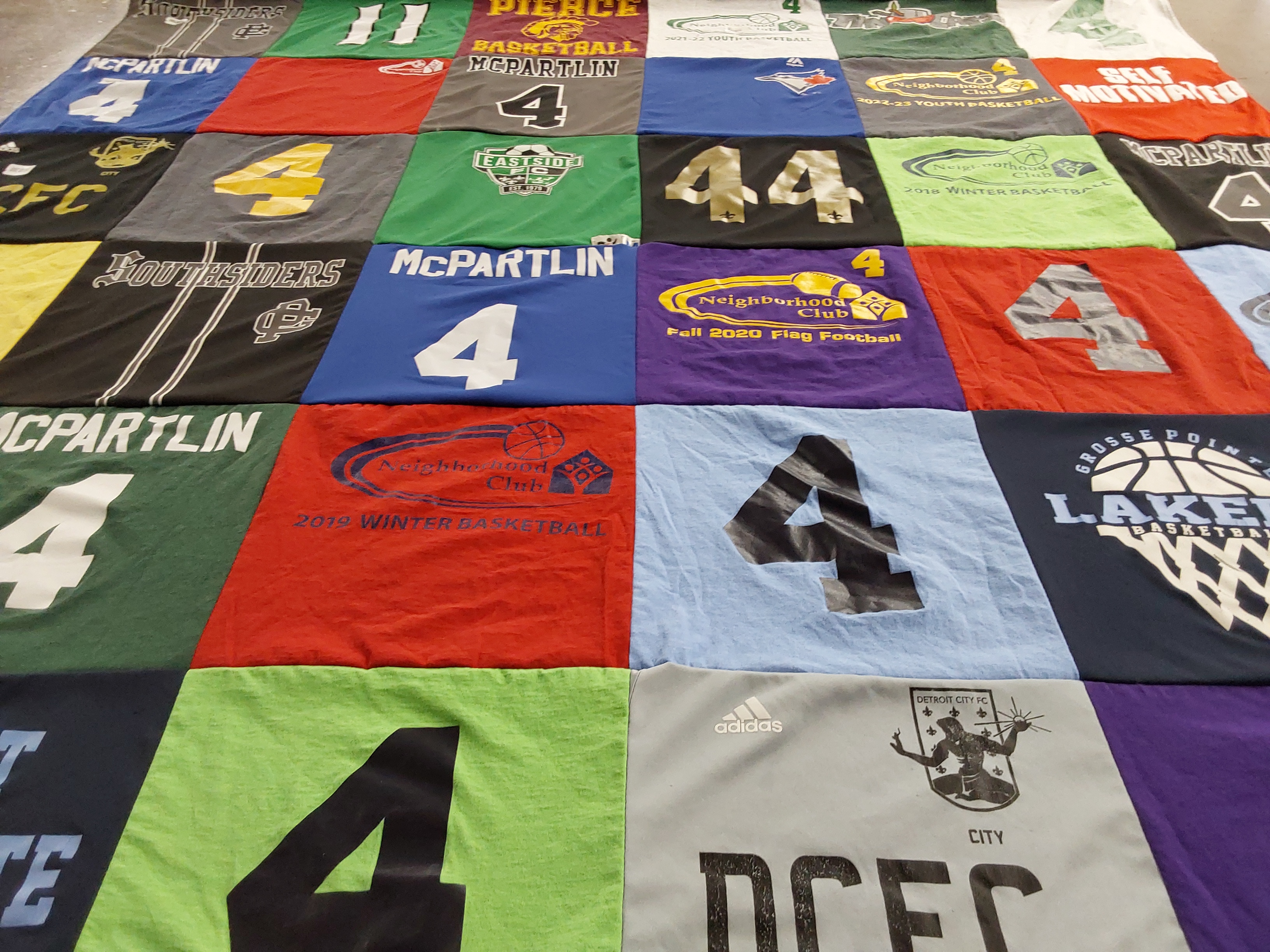 T-shirt quilt featuring grosse pointe lake erie basketball team, detroit city fc by Sarah from MI
